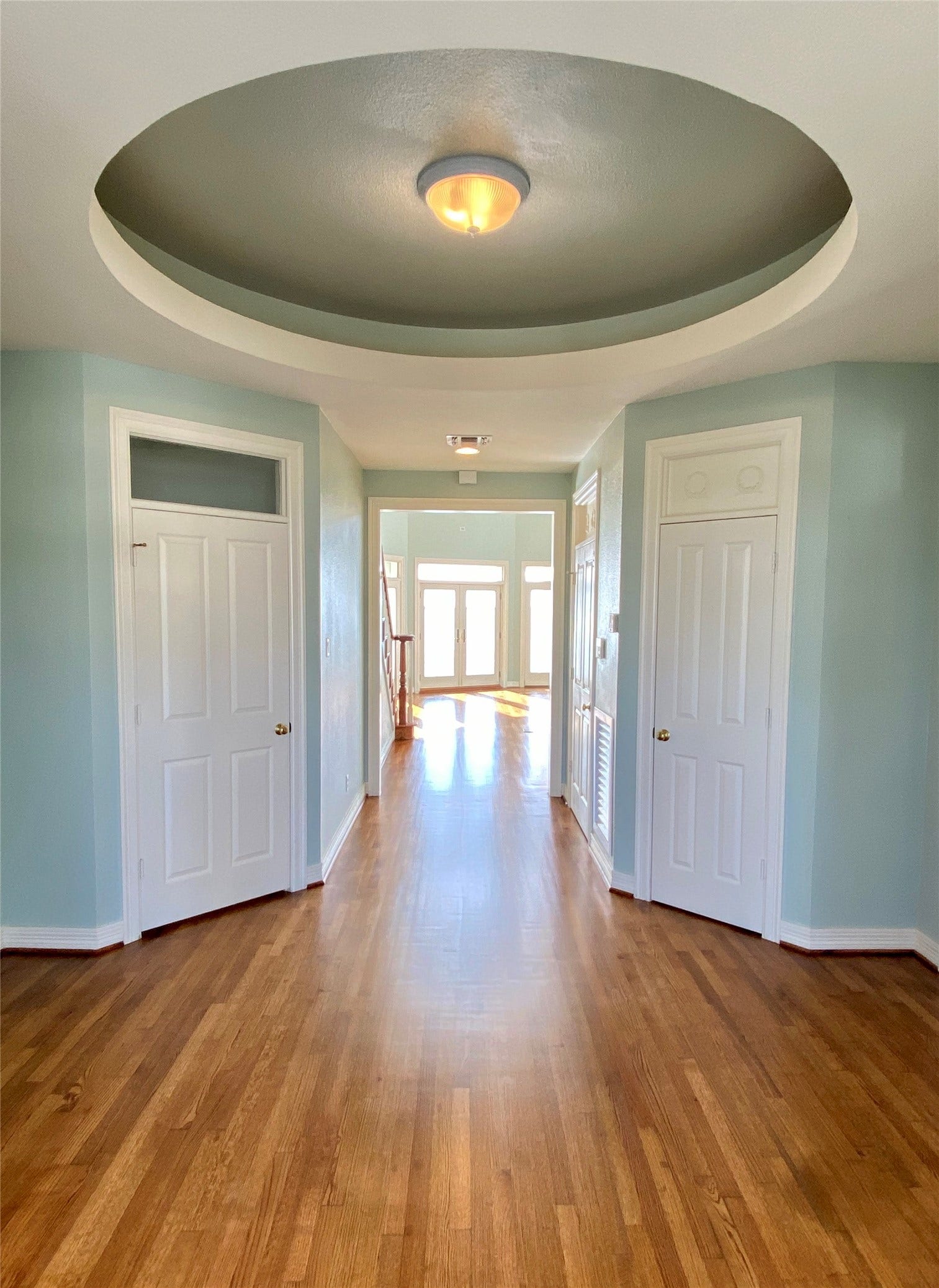 919 Long Reach Drive, Tiki Island, TX 77554 Welcome to this domed foyer. Door to the left leads to an inner staircase from the garage. On the right is one of many closets.