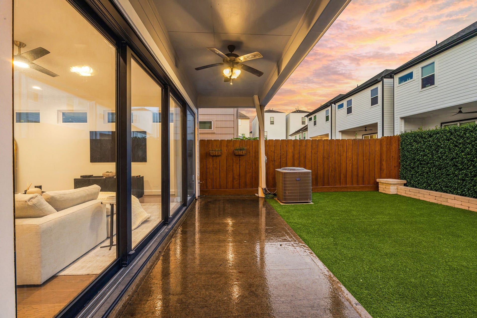 5537 Petty Street, Houston, TX 77007 Experience seamless indoor-outdoor living with this covered patio featuring ceiling fans and a view of the beautifully landscaped backyard, complete with artificial turf for low maintenance.