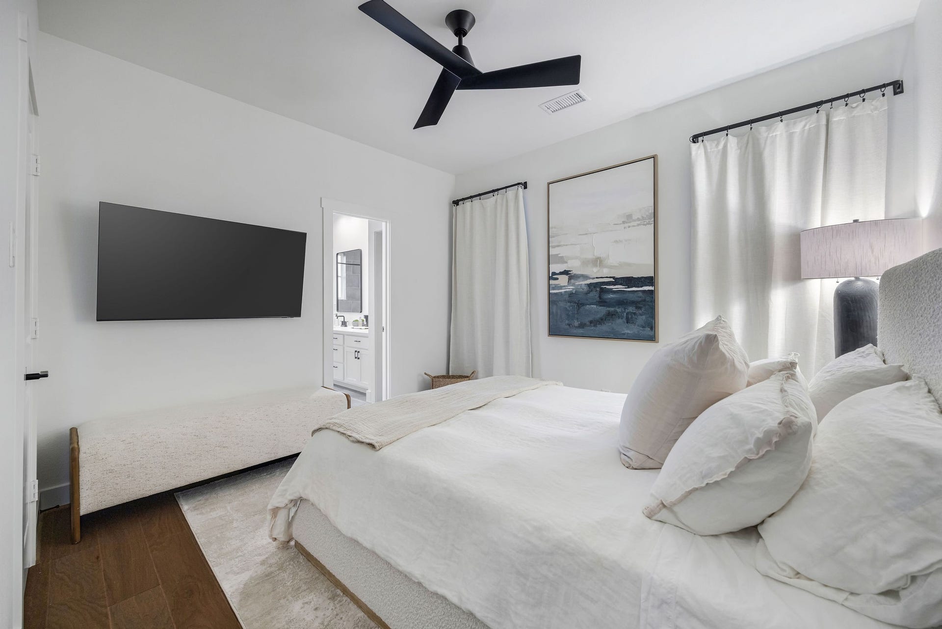 5537 Petty Street, Houston, TX 77007 Bright and modern bedroom featuring a sleek ceiling fan, en-suite bathroom for added convenience.