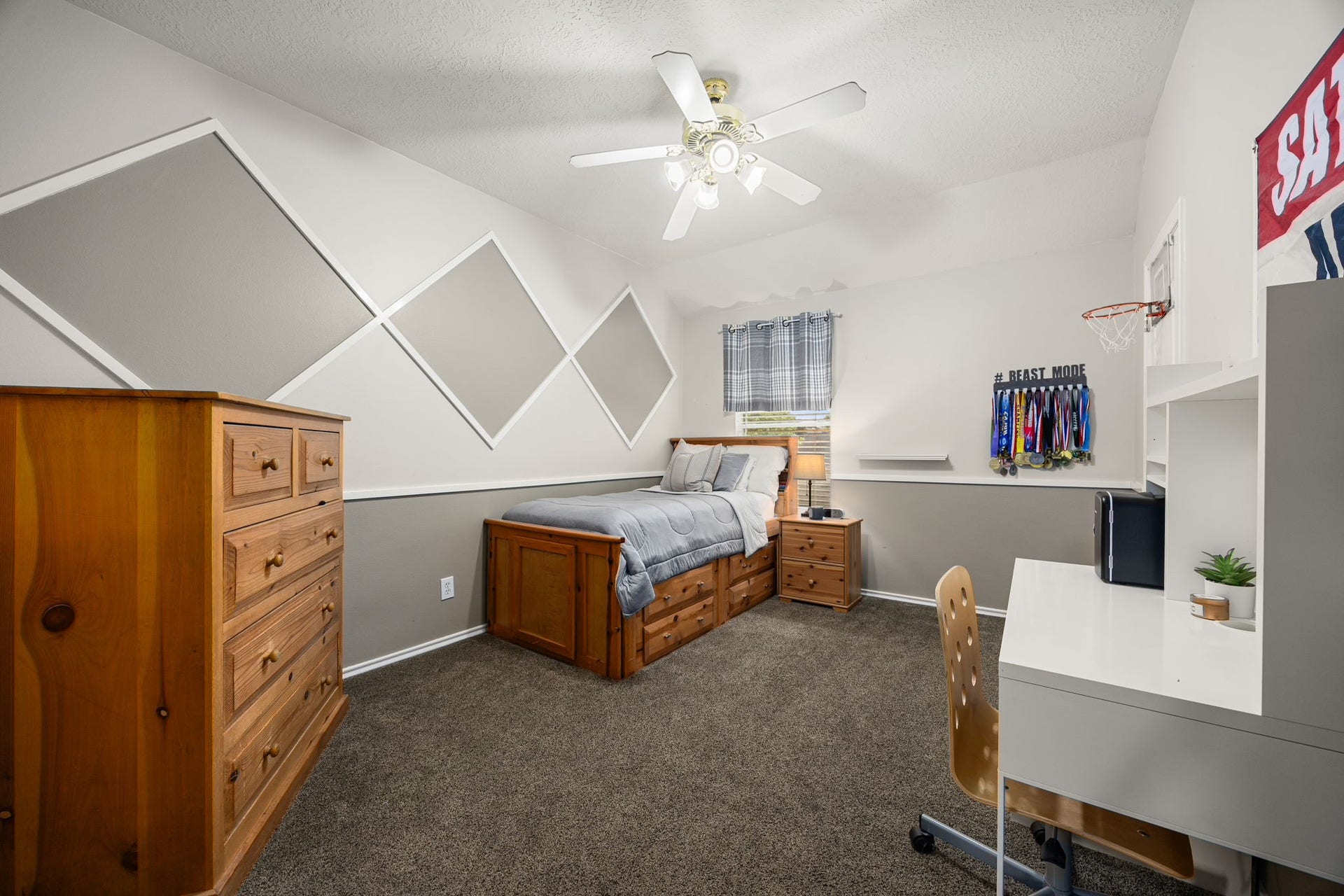 1427 Queens Bay Drive, Katy, TX 77494 This 5th bedroom upstairs offers fun, custom accent walls and plenty of space for a growing family.