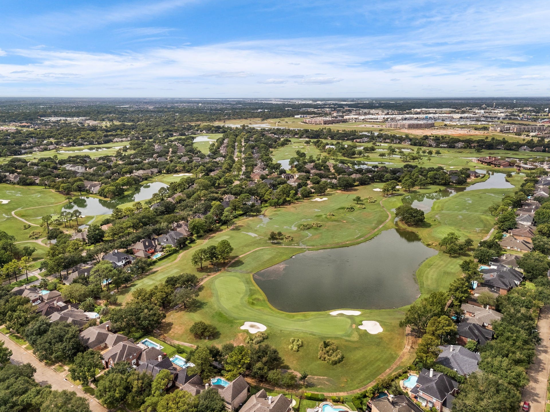 1427 Queens Bay Drive, Katy, TX 77494 Scenic ponds and greenery wind through the neighborhood, offering peaceful views throughout the community.
