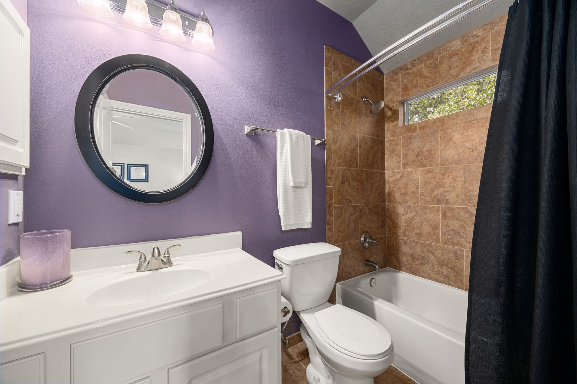 1427 Queens Bay Drive, Katy, TX 77494 This ensuite bathroom offers a vanity, mirror, and a tub/shower combo for everyday comfort.