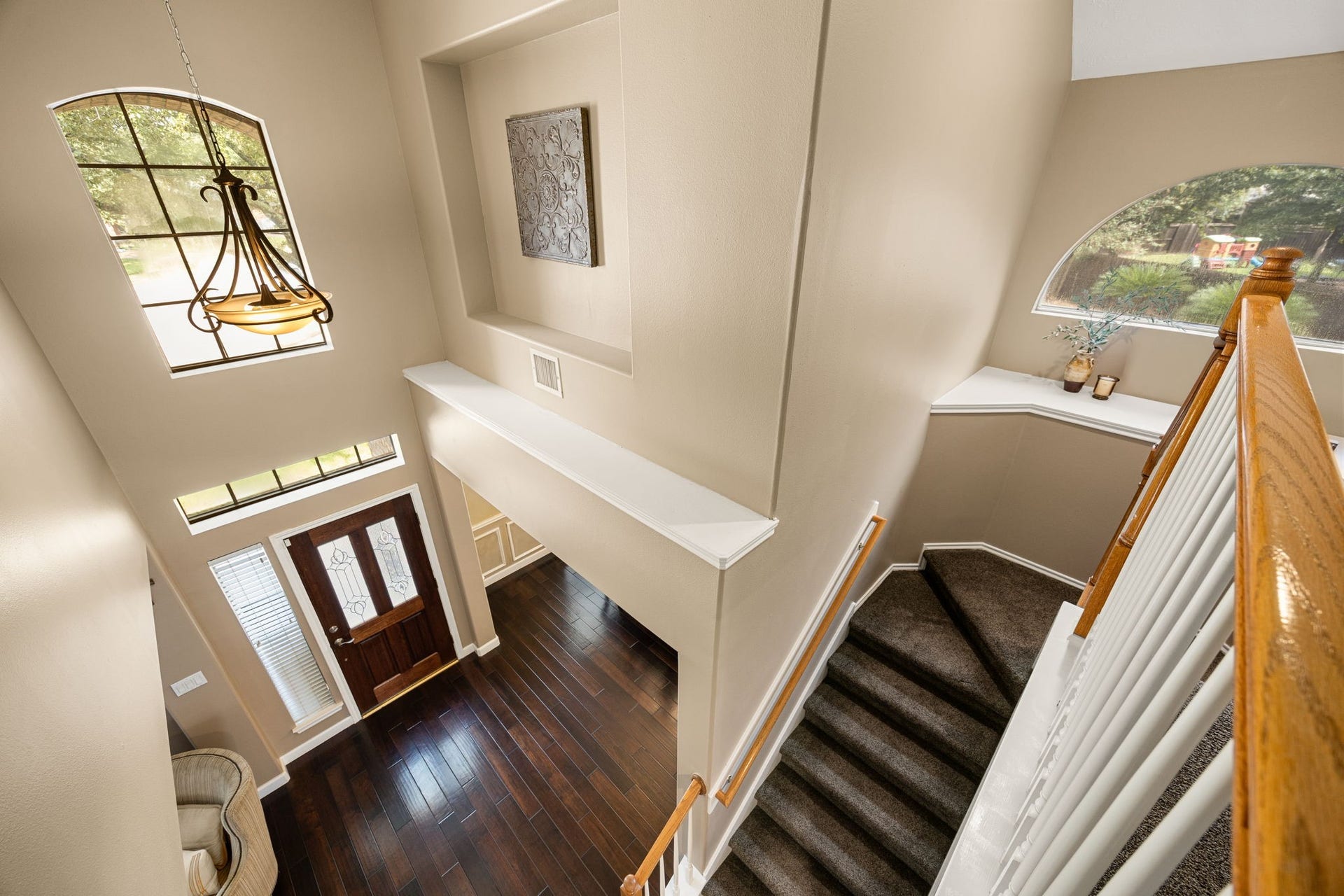 1427 Queens Bay Drive, Katy, TX 77494 The staircase leads up to the home's second floor, offering a beautiful look down into the soaring entry below.