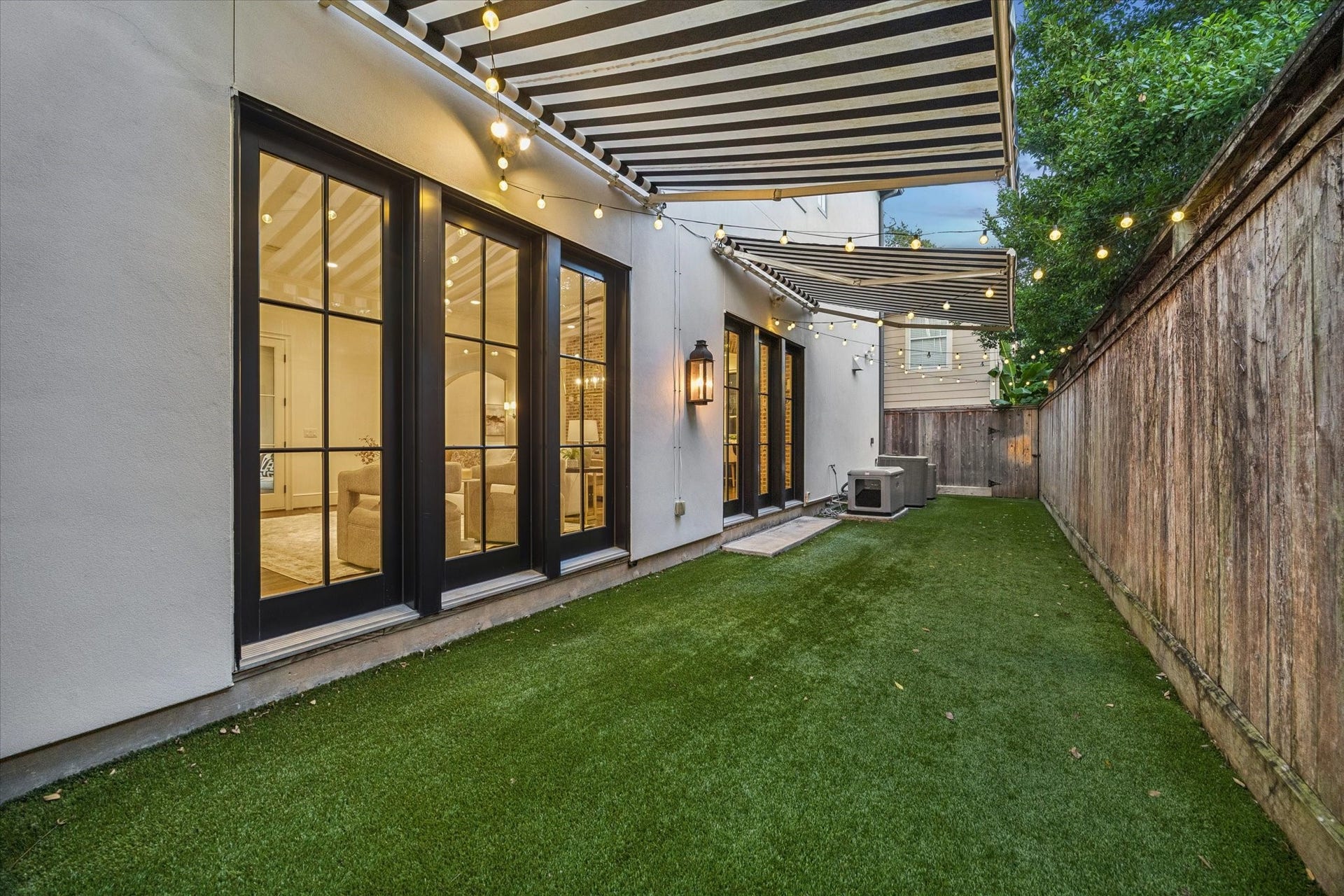 1647 Vassar Street, Houston, TX 77006 Inviting outdoor retreat with an automatic retractable awning, perfect for shaded relaxation and effortless entertaining.