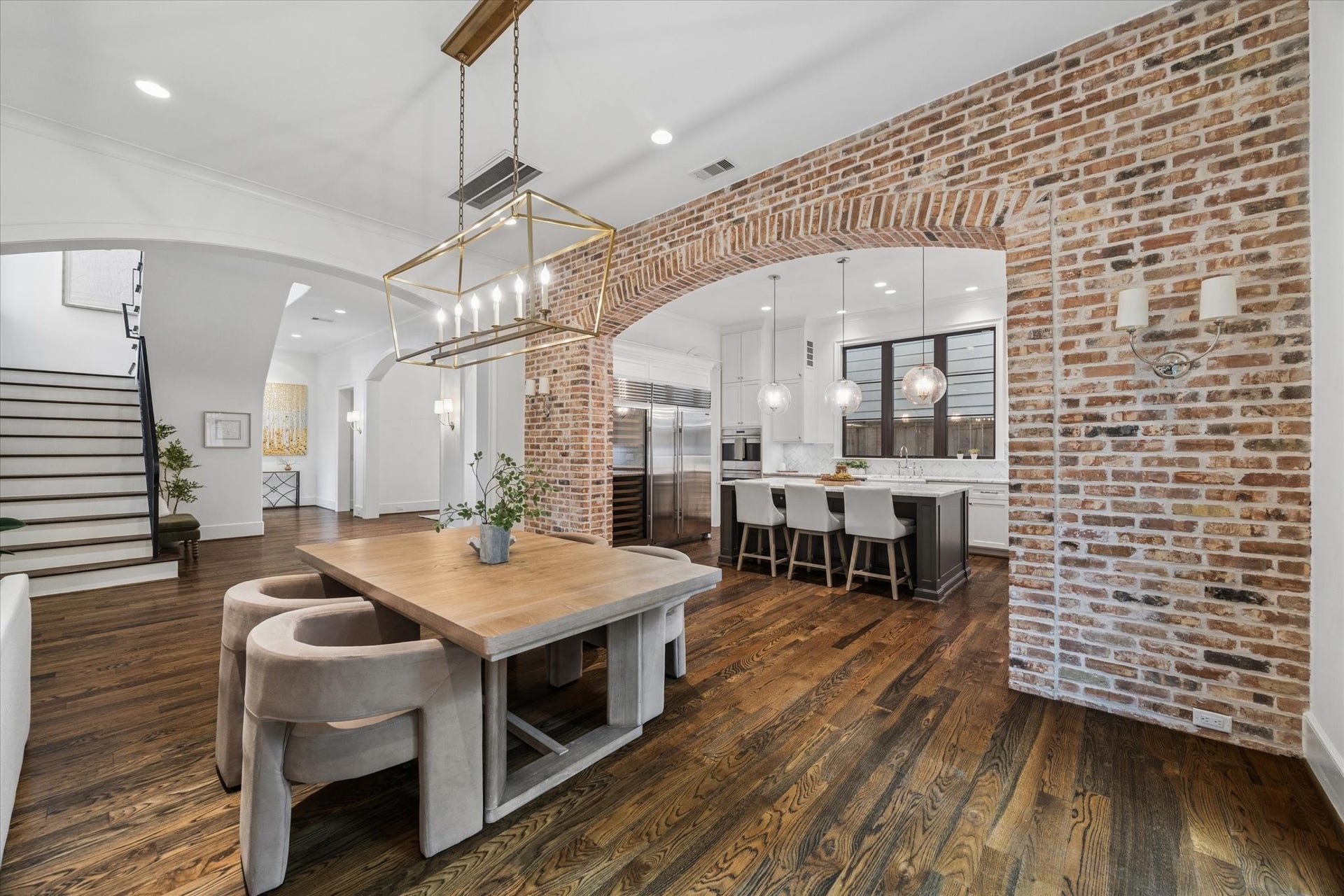 1647 Vassar Street, Houston, TX 77006 Dining area with exposed brick accents and courtyard views.