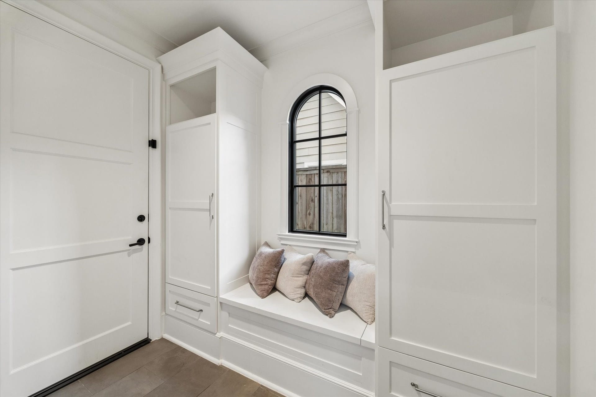 1647 Vassar Street, Houston, TX 77006 Charming mudroom with built-in window seat and surrounding storage.