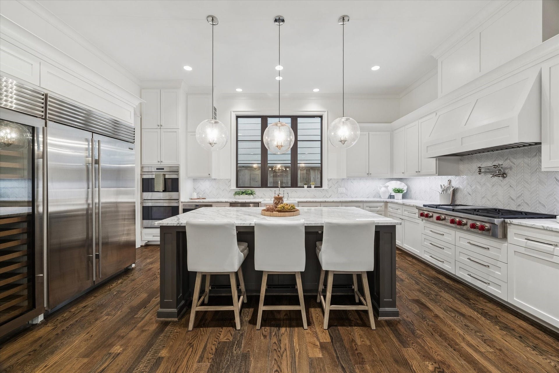 1647 Vassar Street, Houston, TX 77006 Chefs kitchen featuring a Sub Zero fridge & wine cooler and generous seating.
