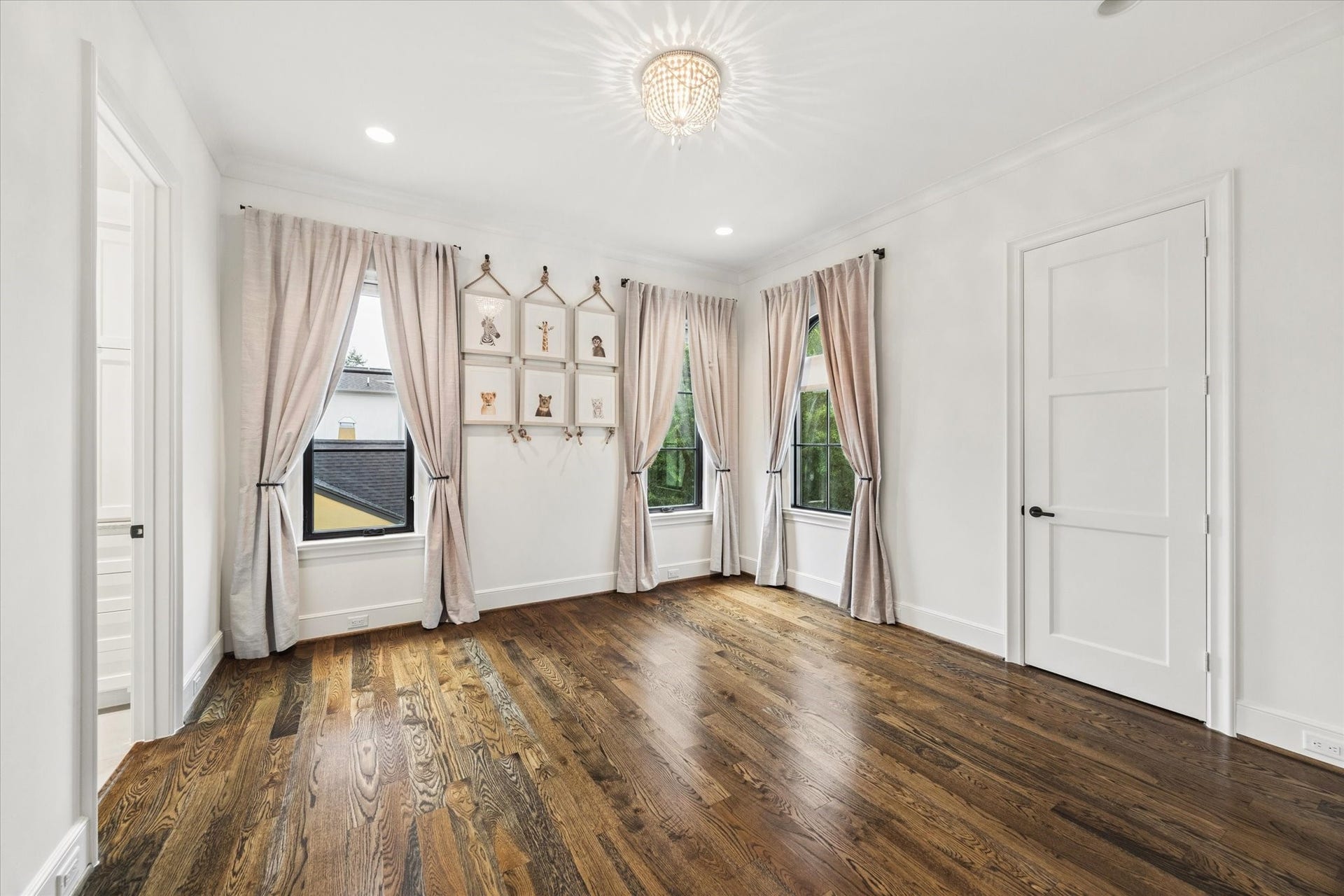 1647 Vassar Street, Houston, TX 77006 Secondary bedroom with wood flooring and natural light.