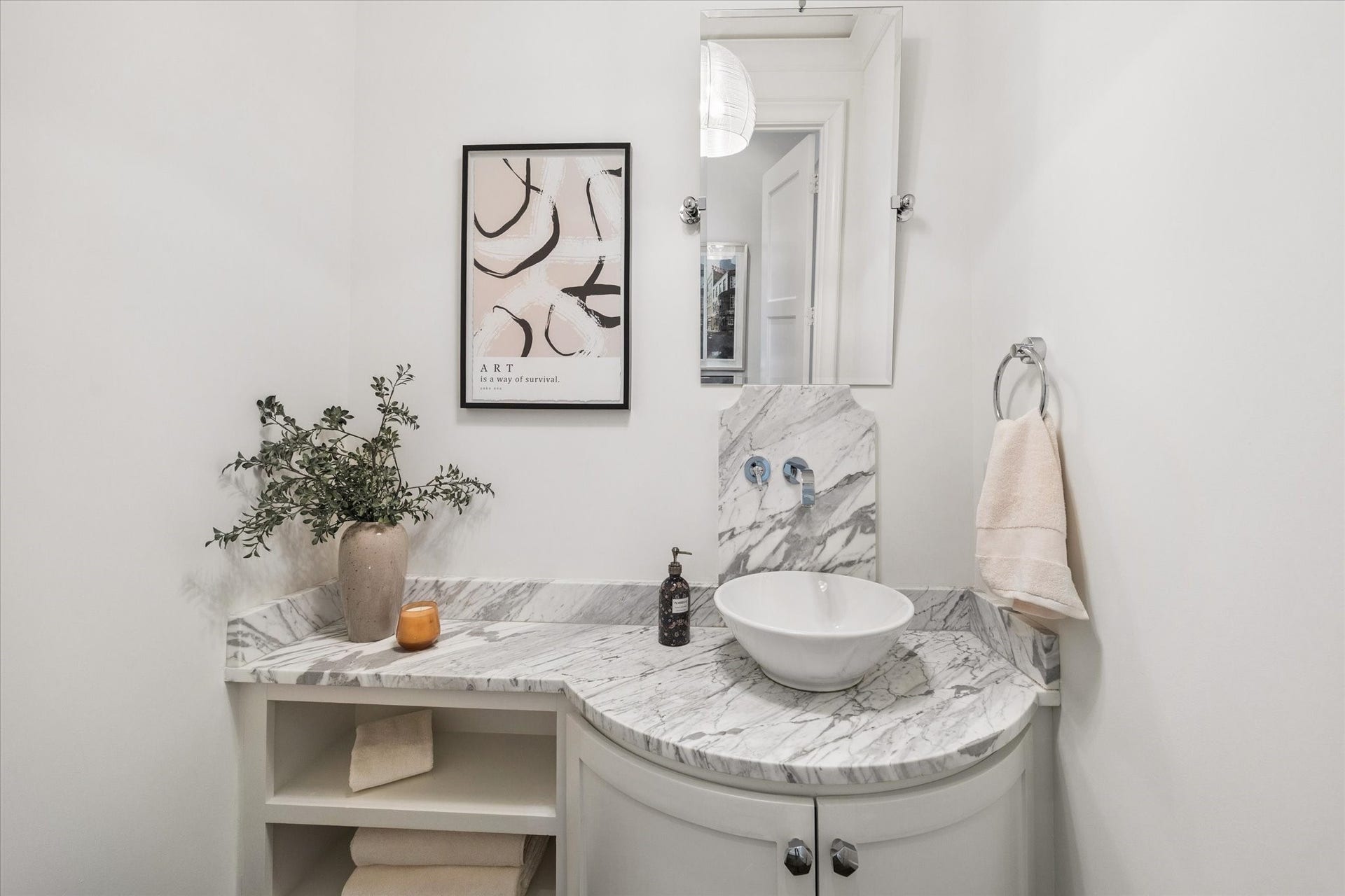 1647 Vassar Street, Houston, TX 77006 Elegant powder bath with decorative lighting and refined finishes.
