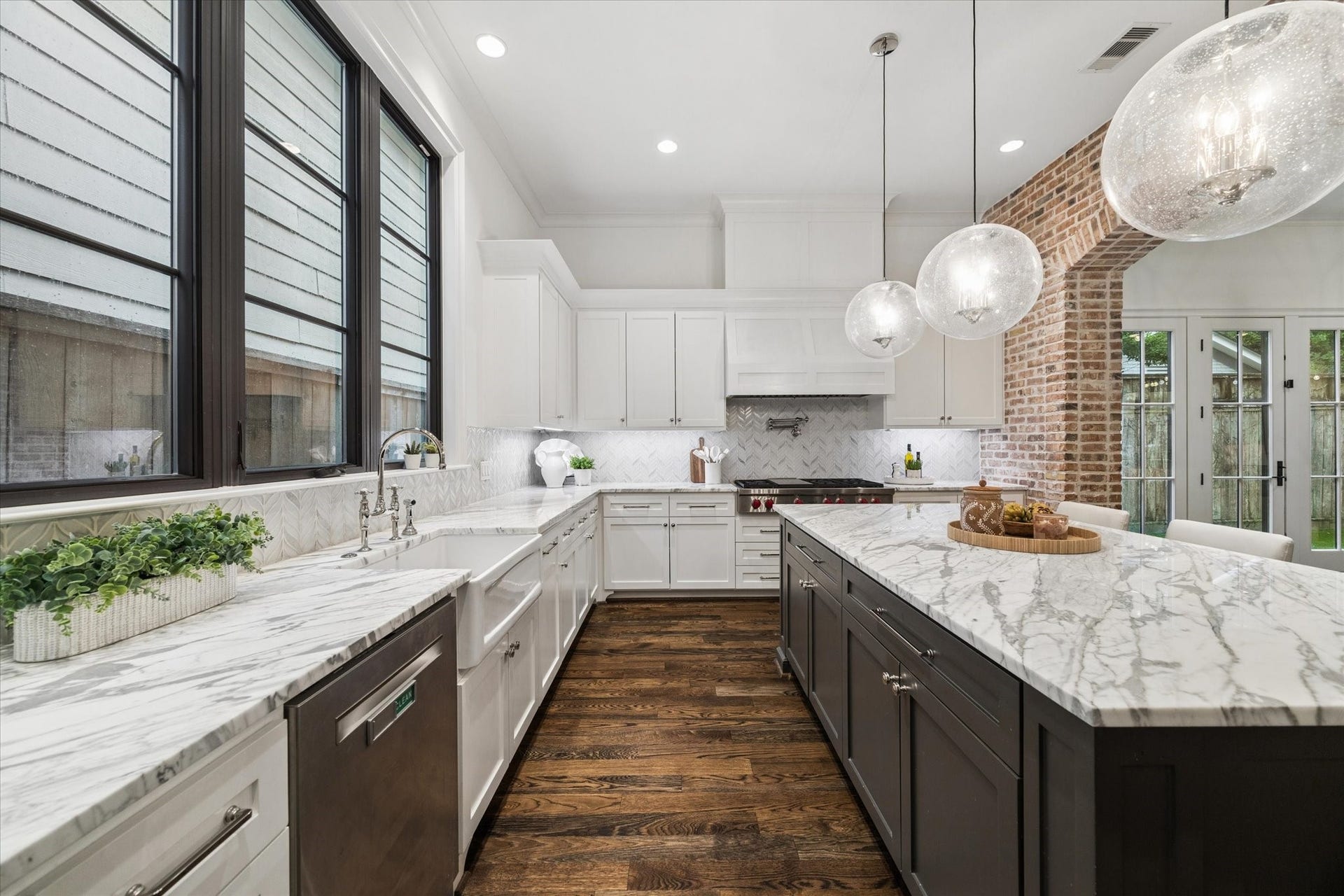 1647 Vassar Street, Houston, TX 77006 Well-appointed kitchen with custom cabinetry by Alcris Construction and abundant natural light.