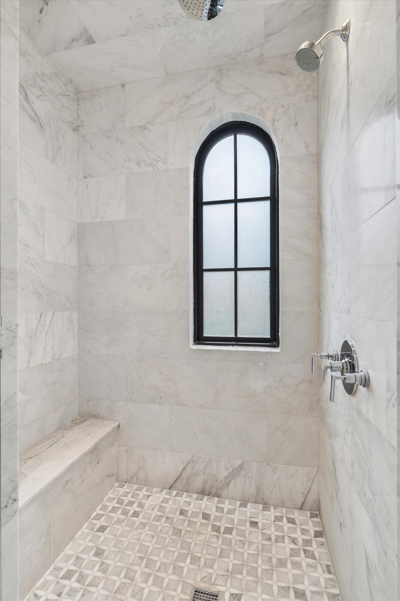 1647 Vassar Street, Houston, TX 77006 Walk-in shower with designer tile and arched window.