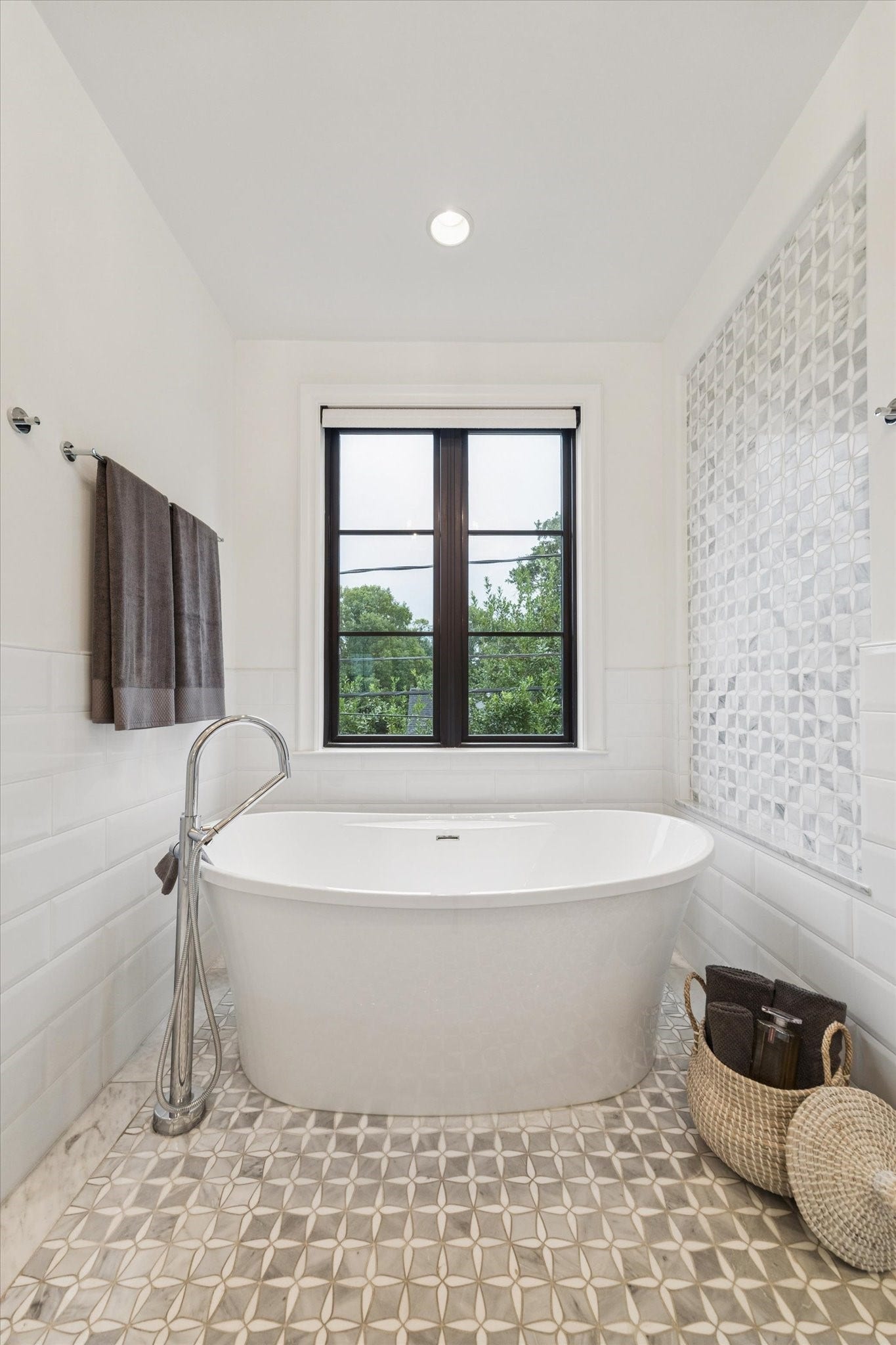1647 Vassar Street, Houston, TX 77006 Freestanding soaking tub beneath a large window.