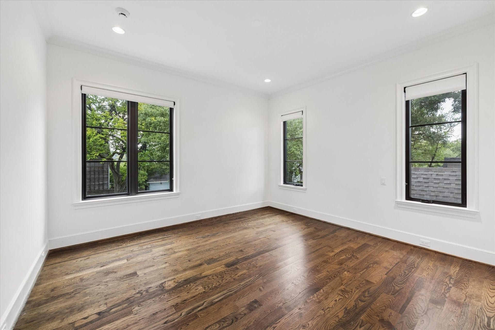 1647 Vassar Street, Houston, TX 77006 Bright secondary bedroom with wood flooring and large windows.