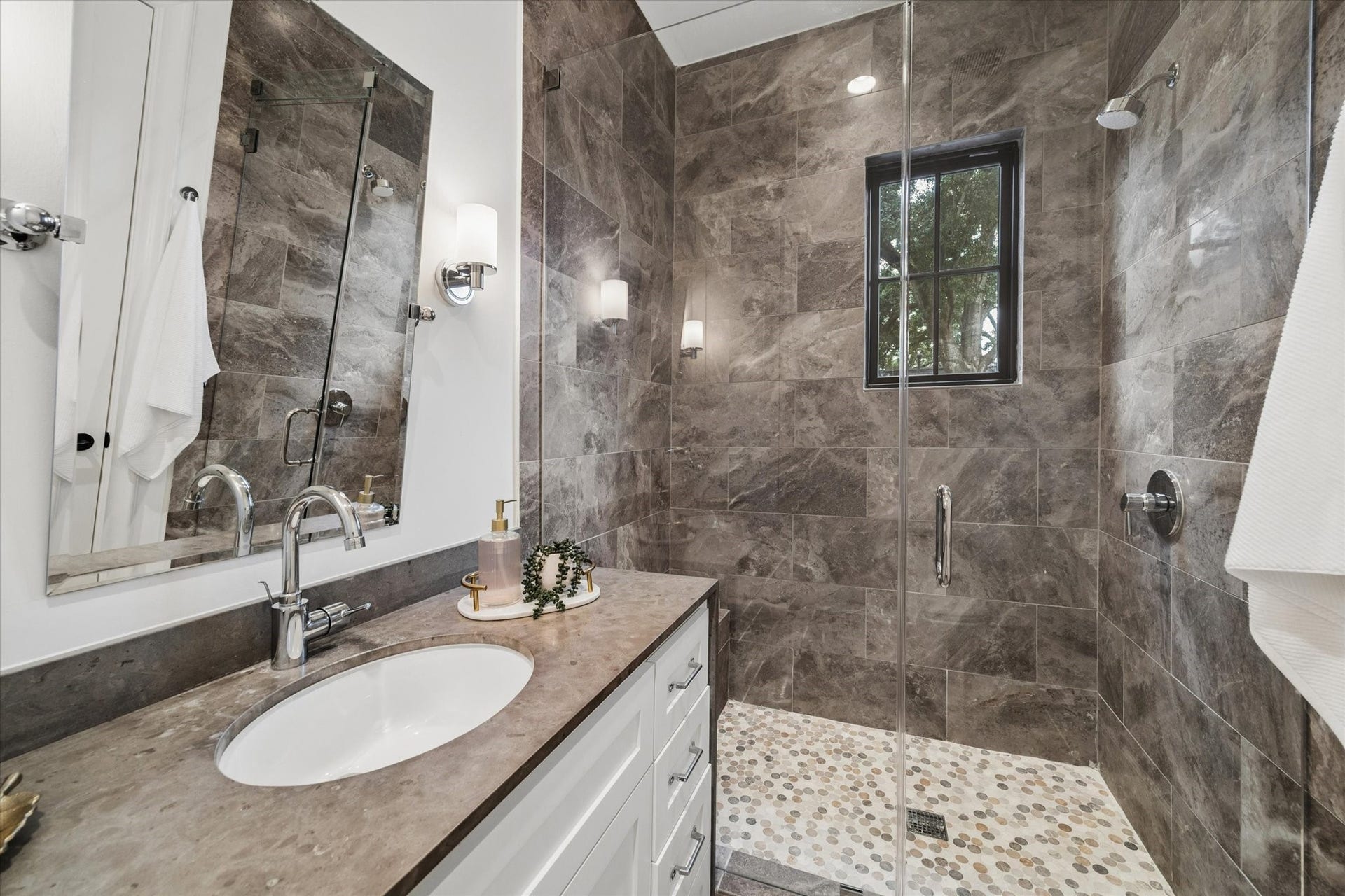 1647 Vassar Street, Houston, TX 77006 En-suite bathroom with designer tile and glass-enclosed shower.