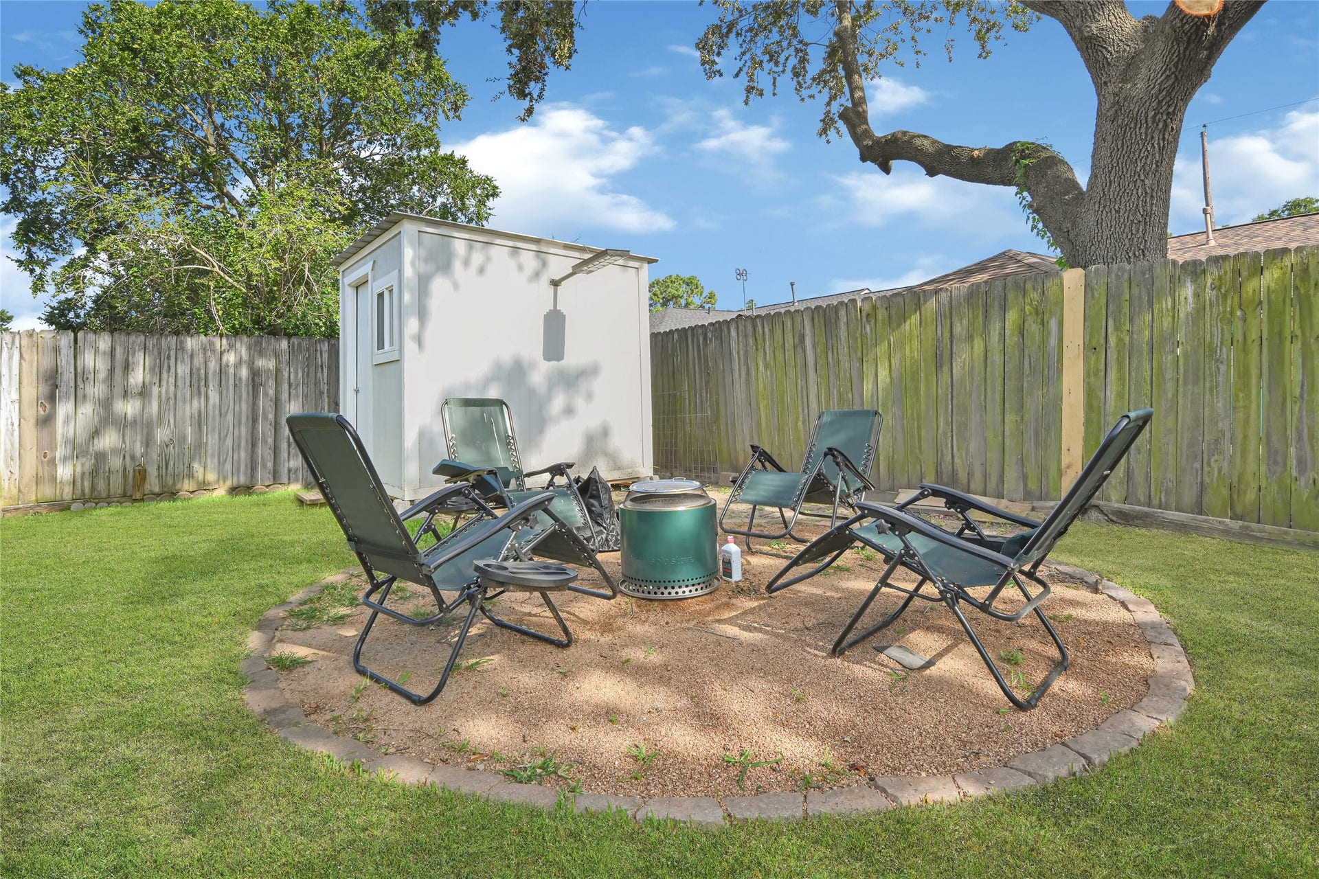 209 W 6th Street, Deer Park, TX 77536 Cozy up by the inviting fire pit, perfect for enjoying cool evenings and making s'mores under the stars.
