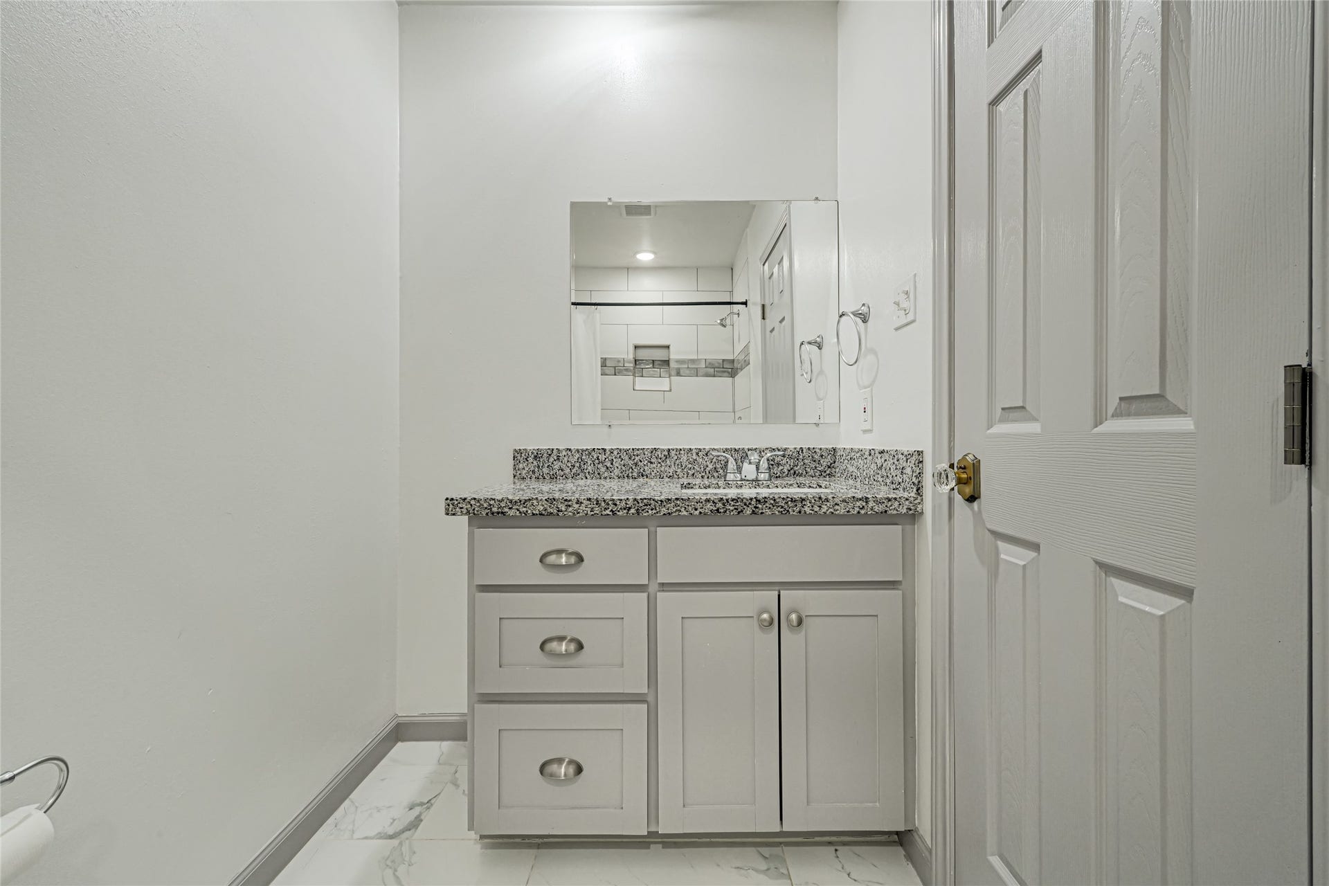 209 W 6th Street, Deer Park, TX 77536 The primary bath vanity features granite countertops and ample storage space for all your essentials.