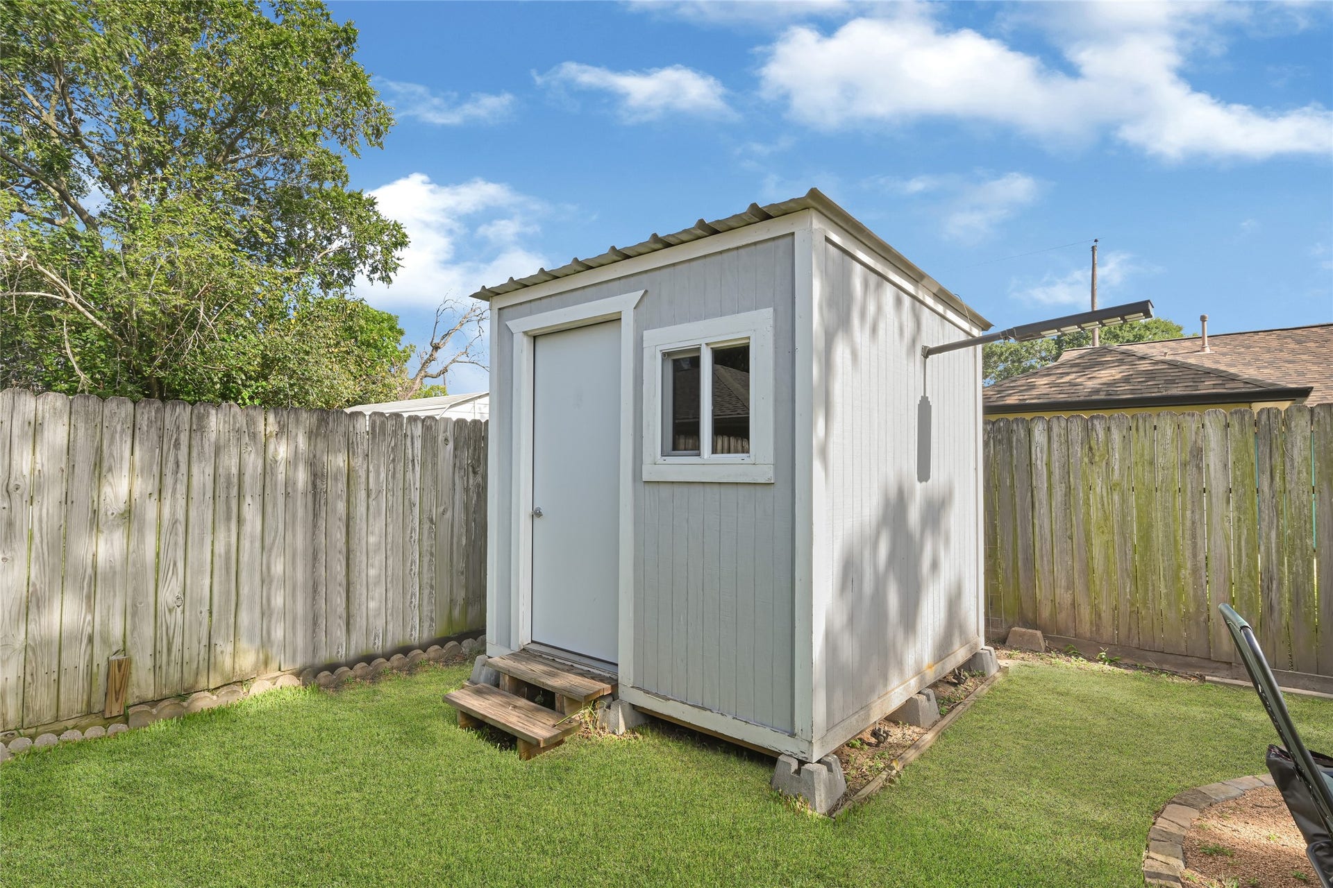 209 W 6th Street, Deer Park, TX 77536 Discover effortless organization with the backyard shed, perfect for storing outdoor equipment, gardening tools, and seasonal essentials.