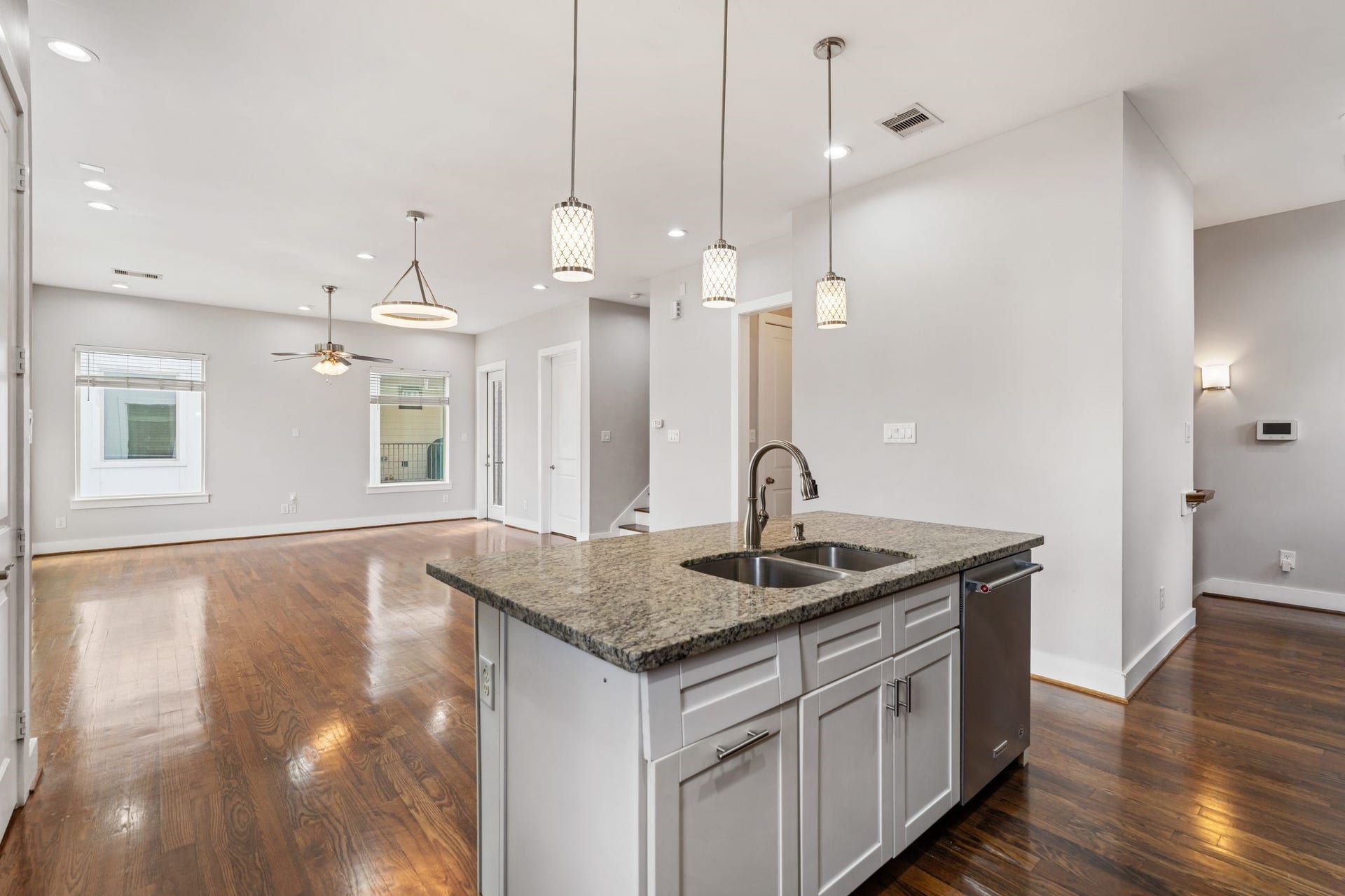 1005 Bingham Street, #5, Houston, TX 77007 The kitchen opens to the living and dining areas with hardwood floors throughout.