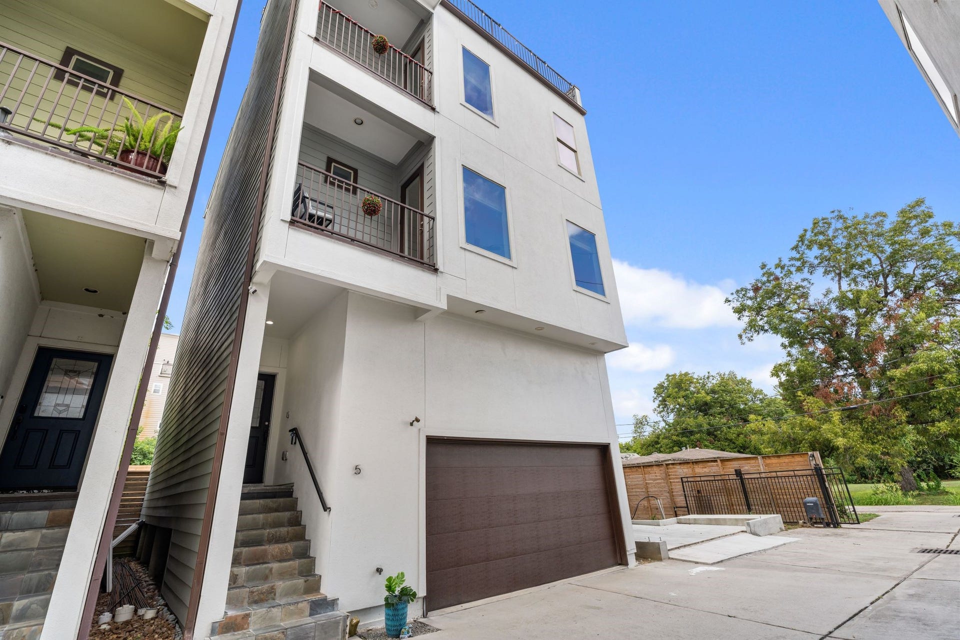 1005 Bingham Street, #5, Houston, TX 77007 Exterior of the home, located within a gated community.