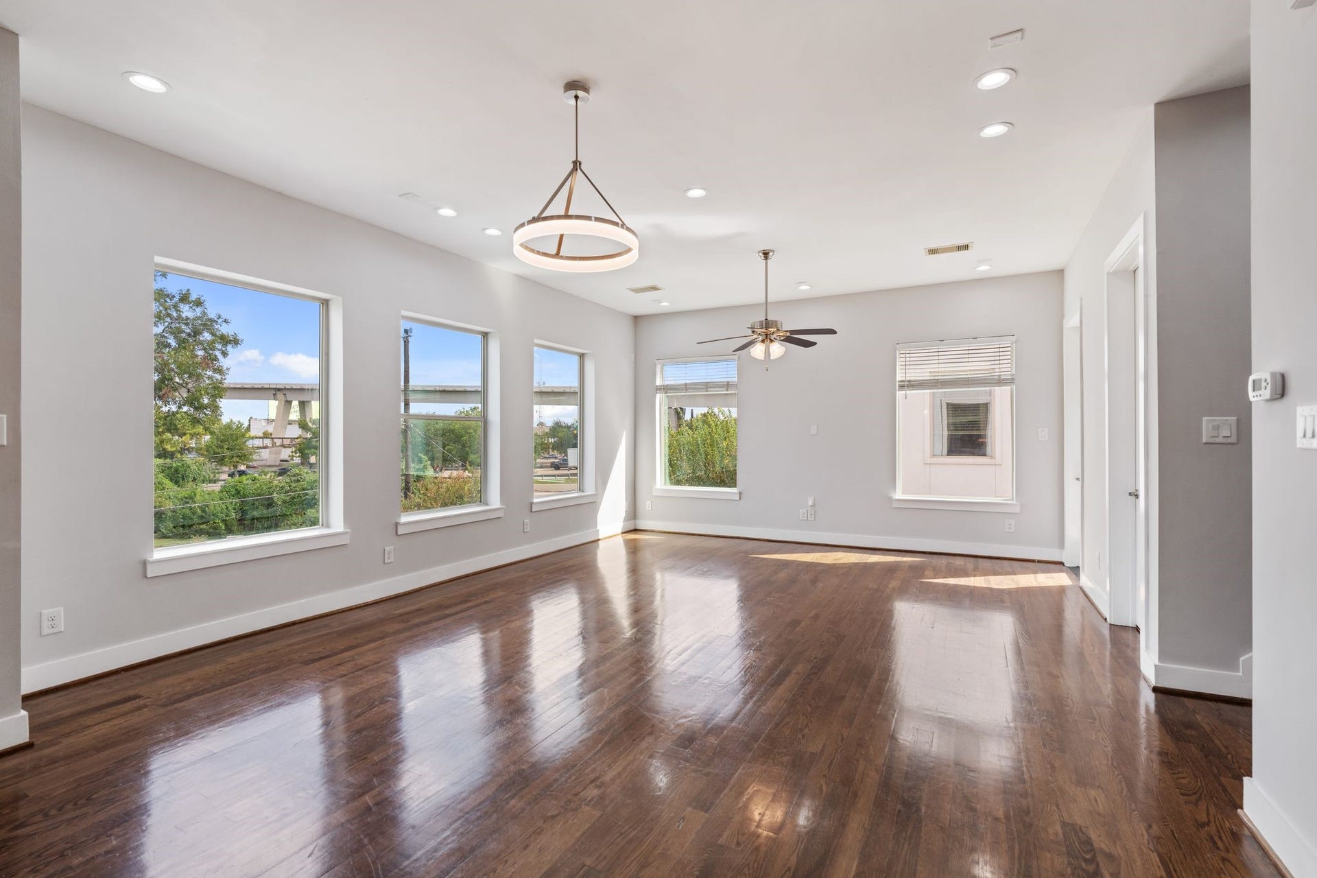 1005 Bingham Street, #5, Houston, TX 77007 Spacious living area with hardwood floors, recessed lighting, large windows, and an open layout.