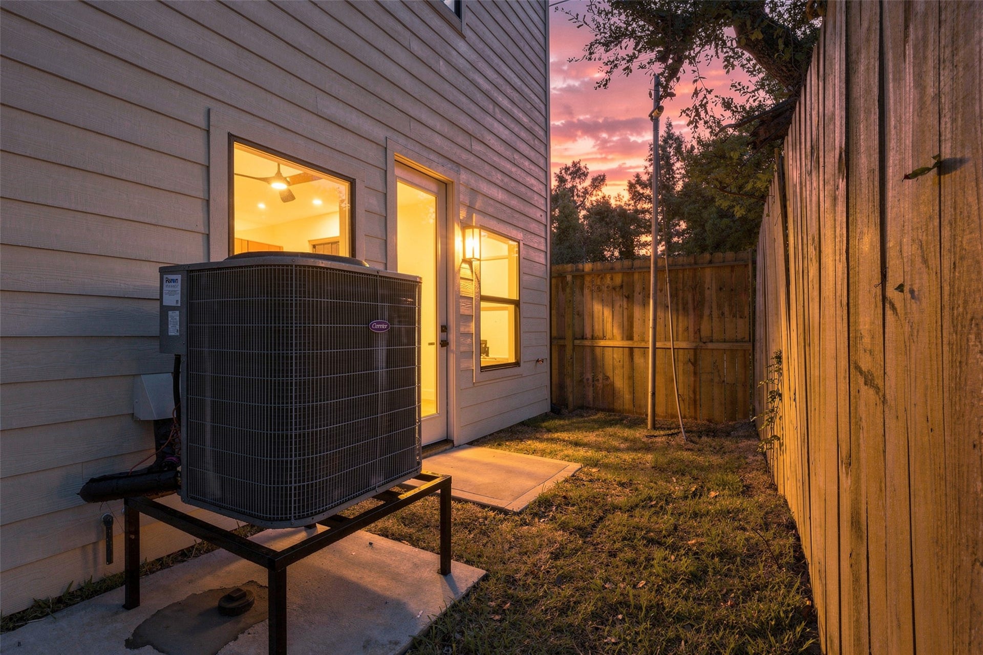 3205 Berry Street, #A/B, Houston, TX 77004 The backyard space features a fenced area and convenient access to the interior, perfect for relaxing evenings.