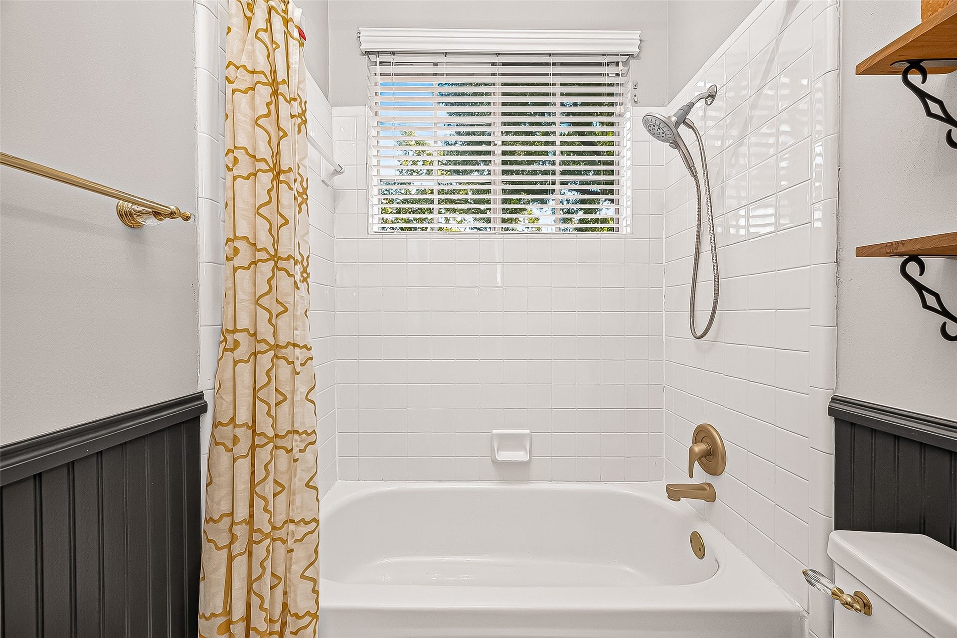 7406 Pleasant Ridge Drive, Houston, TX 77095 Downstairs full bathroom featuring convenient built-in shelving