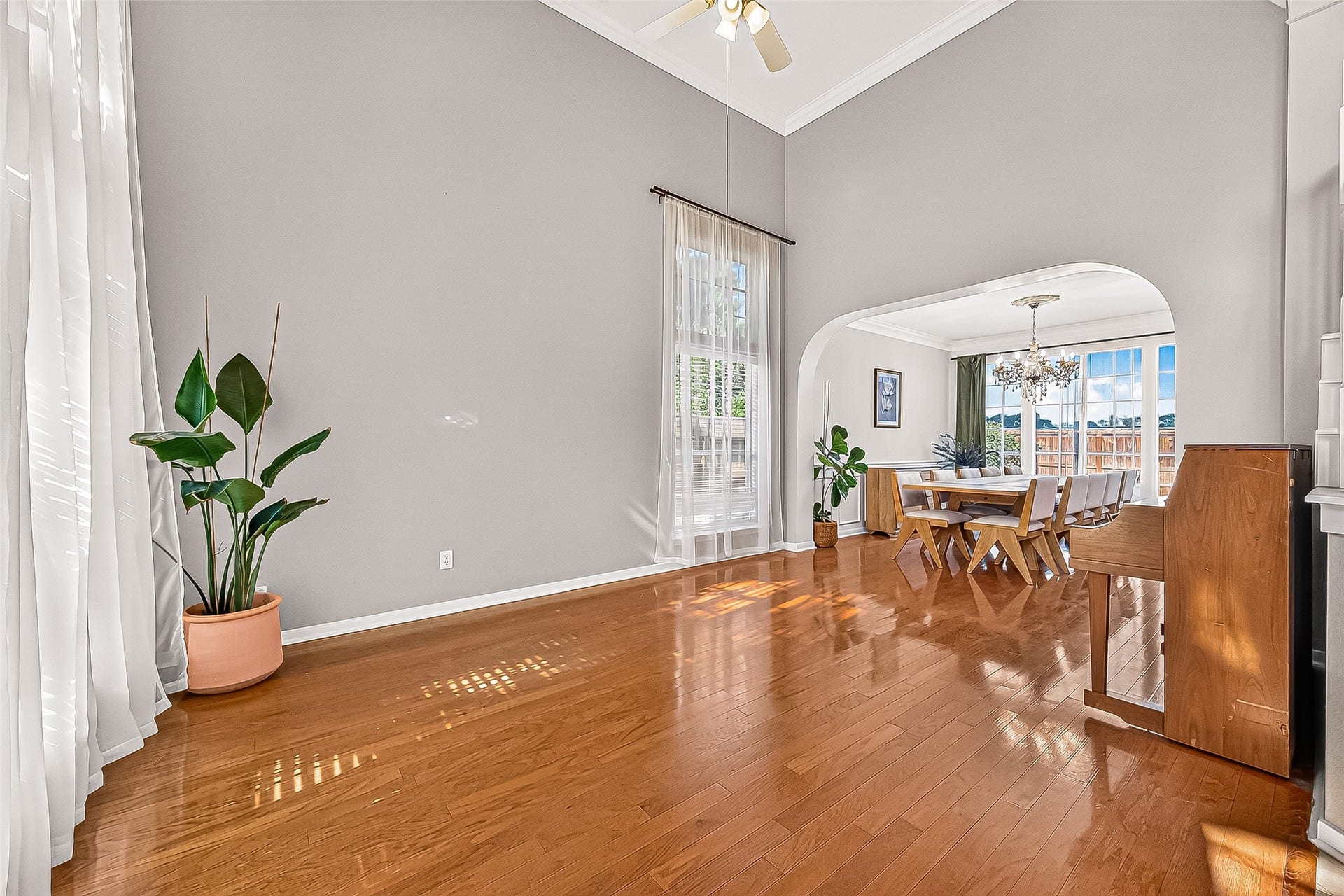 7406 Pleasant Ridge Drive, Houston, TX 77095 Bright, open-concept living room with high ceilings, large windows, and abundant natural light.