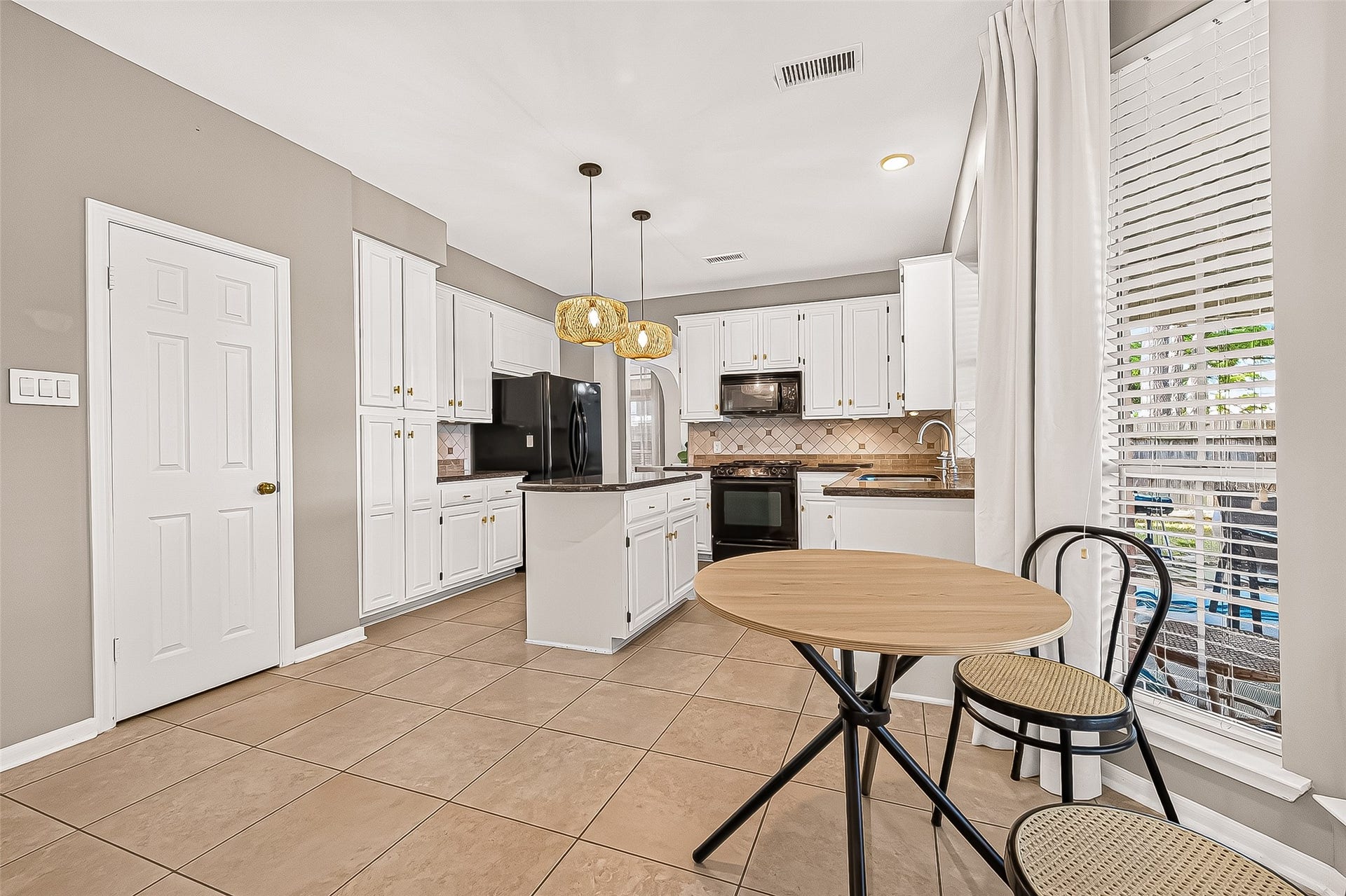 7406 Pleasant Ridge Drive, Houston, TX 77095 Bright, open breakfast area featuring a clear view of the nice backyard and covered patio