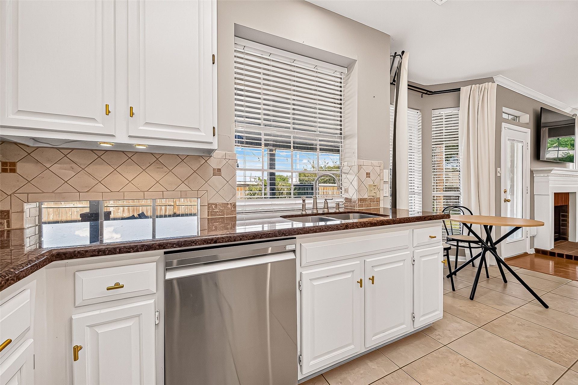 7406 Pleasant Ridge Drive, Houston, TX 77095 elegant backslash, white cabinet, large window by kitchen sink