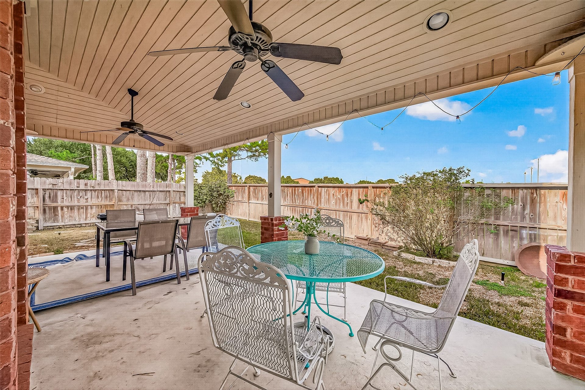 7406 Pleasant Ridge Drive, Houston, TX 77095 large covered patio with fan