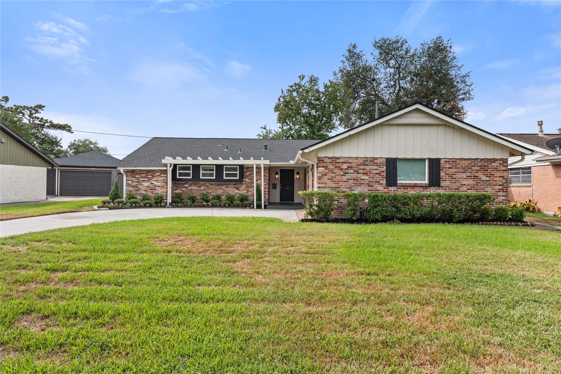 2302 Willowby Drive, Houston, TX 77008 Attached 2 car garage and charming brick exterior. Siding was recently repainted and new front deck installed.