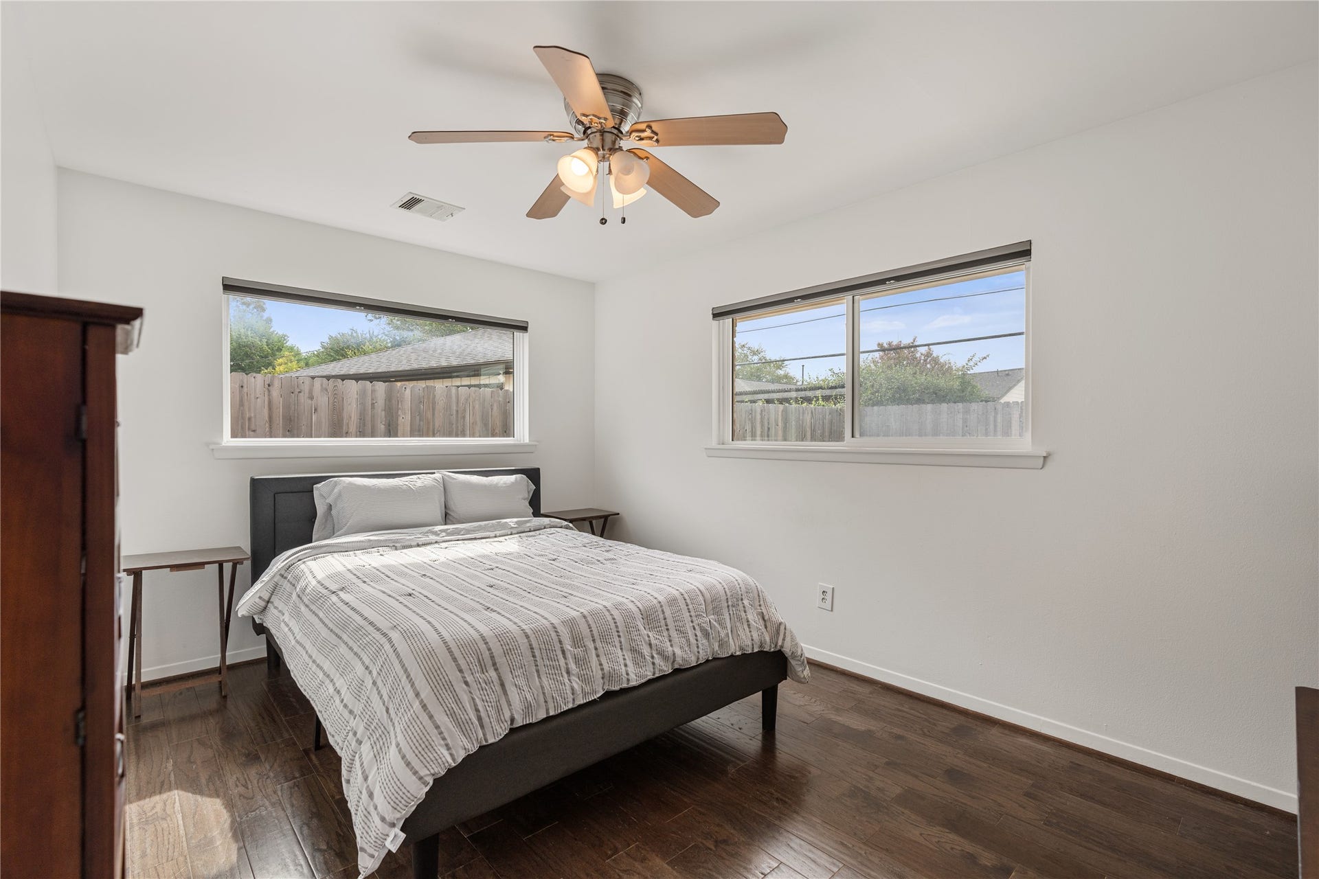 2302 Willowby Drive, Houston, TX 77008 Cozy secondary bedroom with abundant natural light with hardwood floors and a reach-in closet.