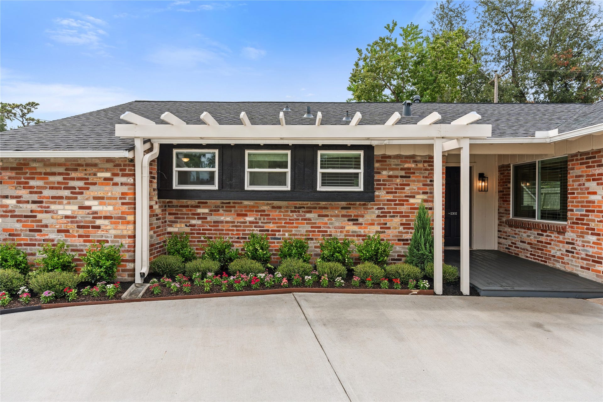 2302 Willowby Drive, Houston, TX 77008 New lush landscaping under custom pergola welcomes you home