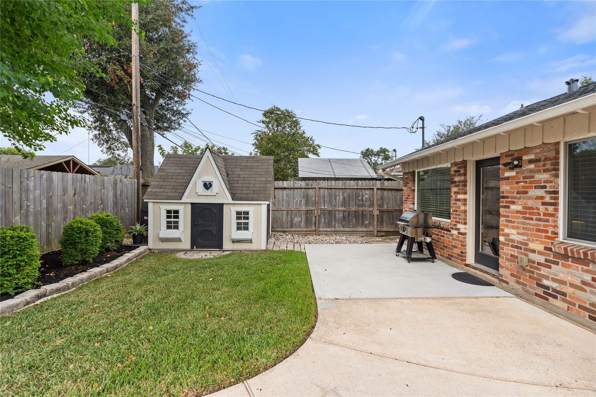 2302 Willowby Drive, Houston, TX 77008 Theres still plenty of backyard beyond the pool, with green space for play or pets + a storage shed that doubles as a playhouse.