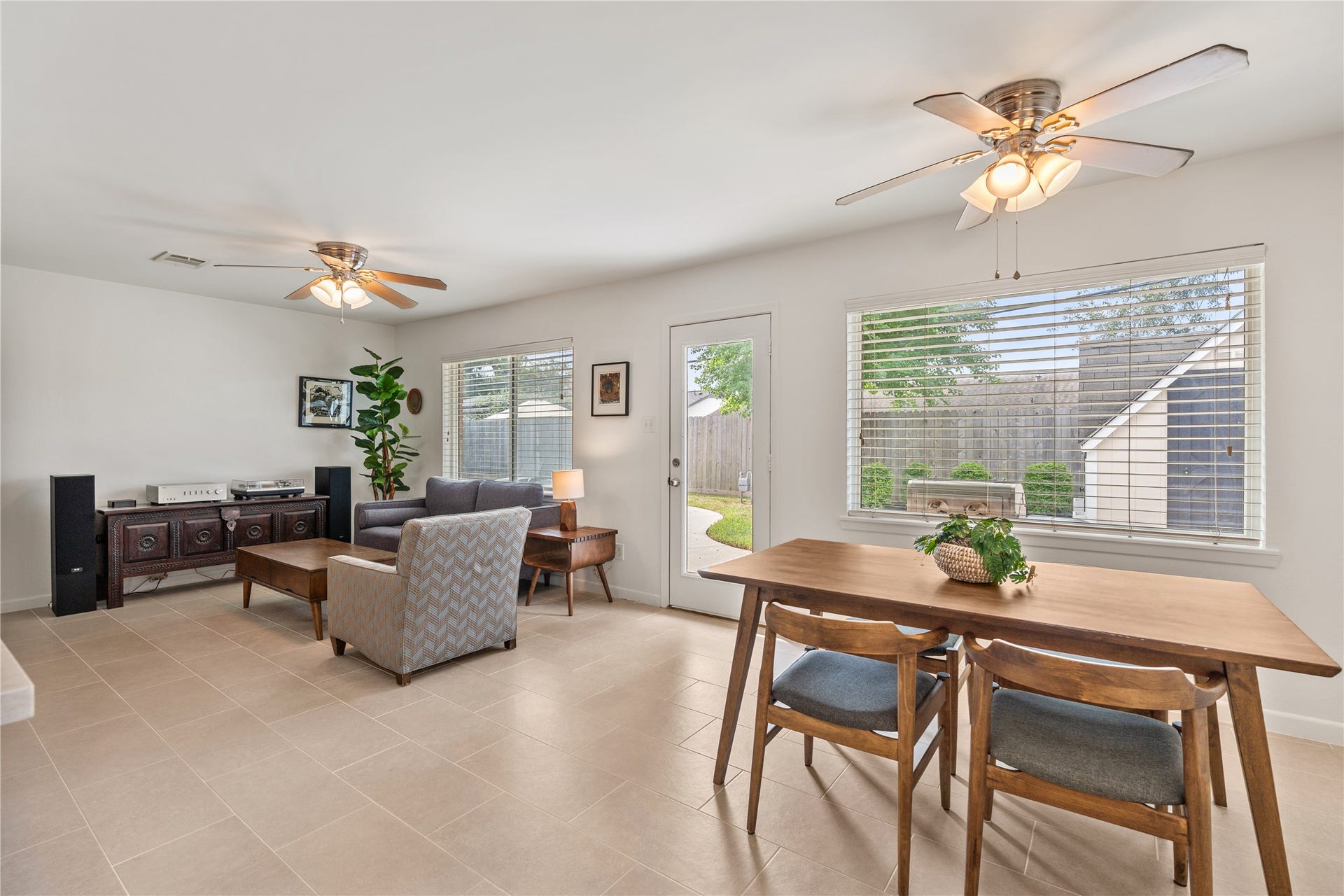 2302 Willowby Drive, Houston, TX 77008 Bright and inviting living space with large windows and seamless flow to the backyard.