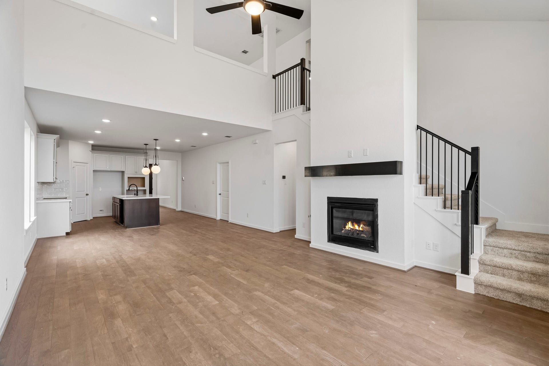 7439 Fraser Peak Drive, Katy, TX 77493 The open family room is completed with a fireplace.