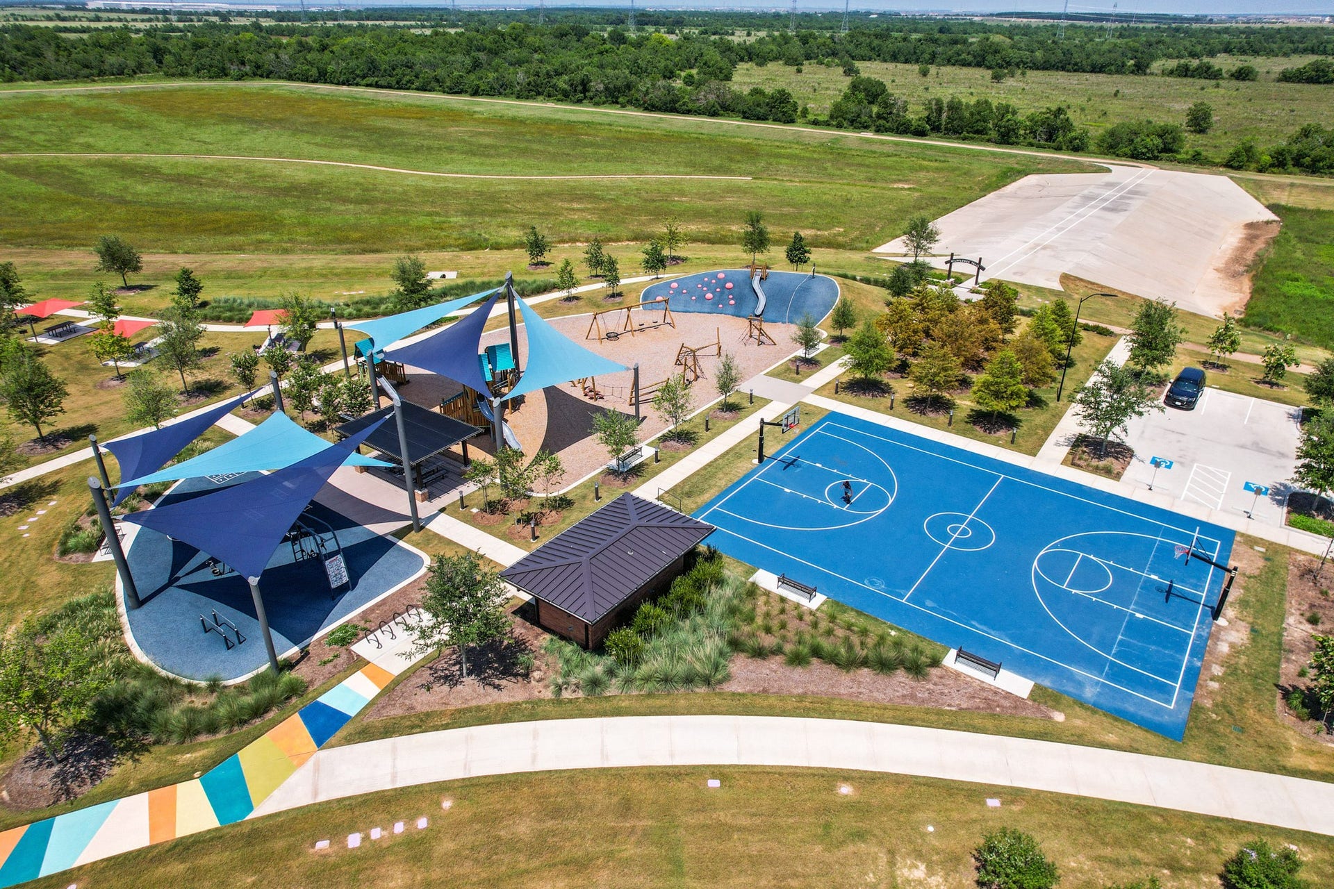 7439 Fraser Peak Drive, Katy, TX 77493 Full size basketball court, full outdoor workout equiment, canopied playgrounds.