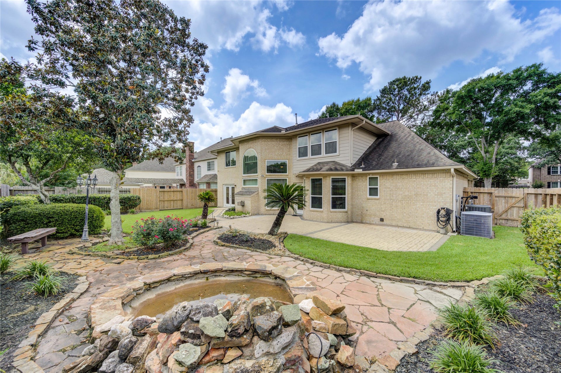 2015 Inscho Lane, Katy, TX 77450 Pond and pavers outline this gorgeous back yard.