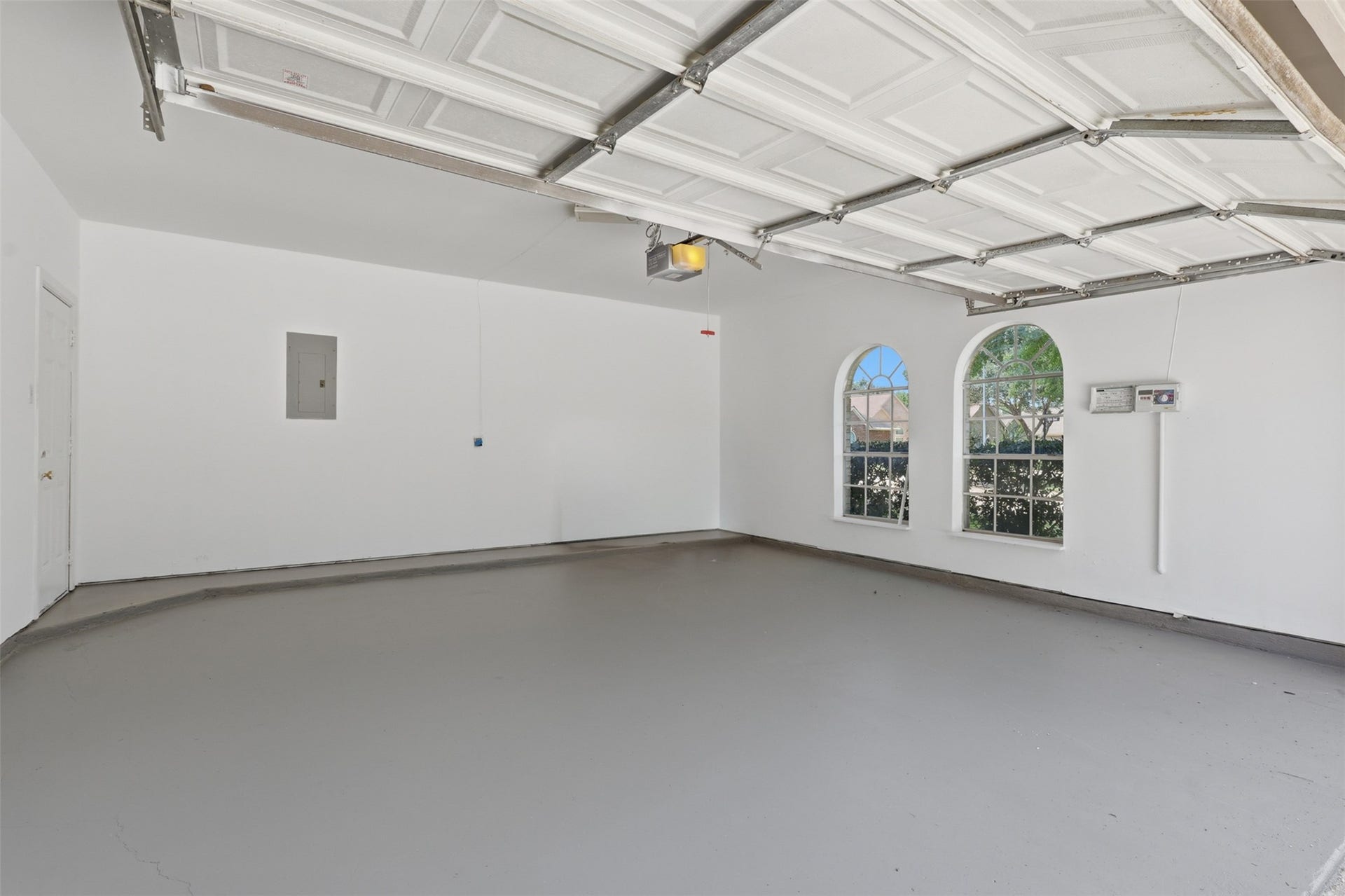 The oversized garage offers plenty of room for vehicles, storage, or a workshop and is finished with durable epoxy flooring for a clean, polished look. This exceptional space combines functionality, easy maintenance, and style with room to spare!