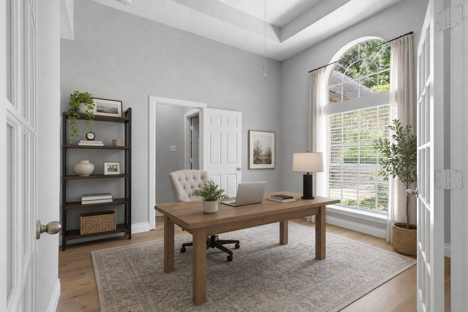 This impressive home office showcases dramatic tall windows that fill the space with natural light while adding stunning architectural character. Fresh interior paint throughout enhances the beauty of this spacious home, creating a bright, inviting atmosphere. What a wonderful place to work, relax, and call home! Photo is Virtually Staged.
