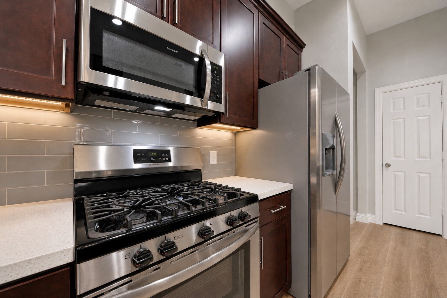 Cook like a chef with the sleek stainless steel 5-burner gas range, complemented by a built-in stainless-steel microwave with an exterior vent that exhausts outside for added efficiency. Beautifully remodeled home feels like new, with almost everything updated or replaced for modern comfort & peace of mind. Now, open the door to discover the spacious walk-in pantry, offering abundant storage for all your kitchen essentials. Make that call today and come see everything this exceptional home has to offer!