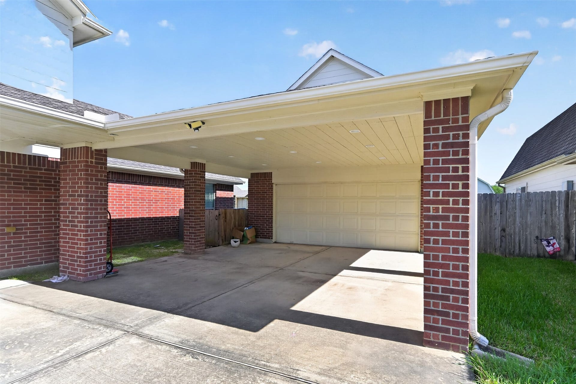 Spacious covered back patioperfect for outdoor dining and entertaining year-round.