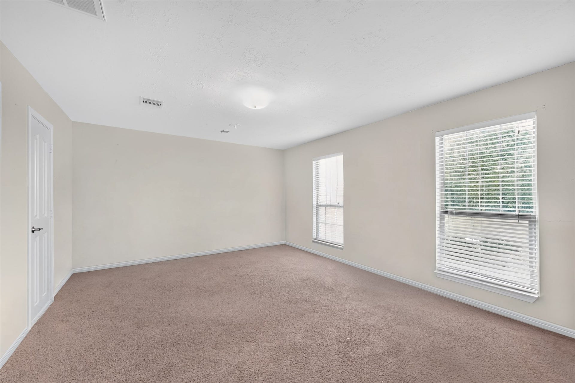 Generously sized bedroom offering plenty of space for large furniture.