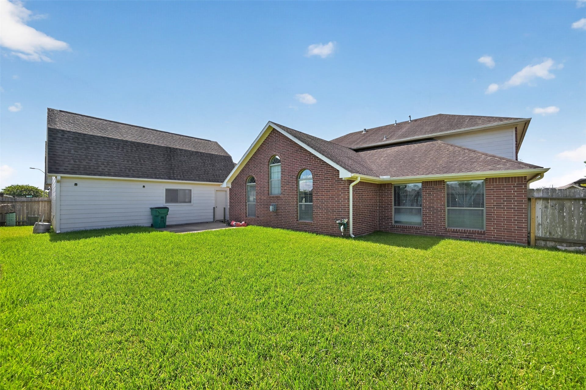 Expansive backyard with plenty of room for a pool, playset, or your dream outdoor oasis.