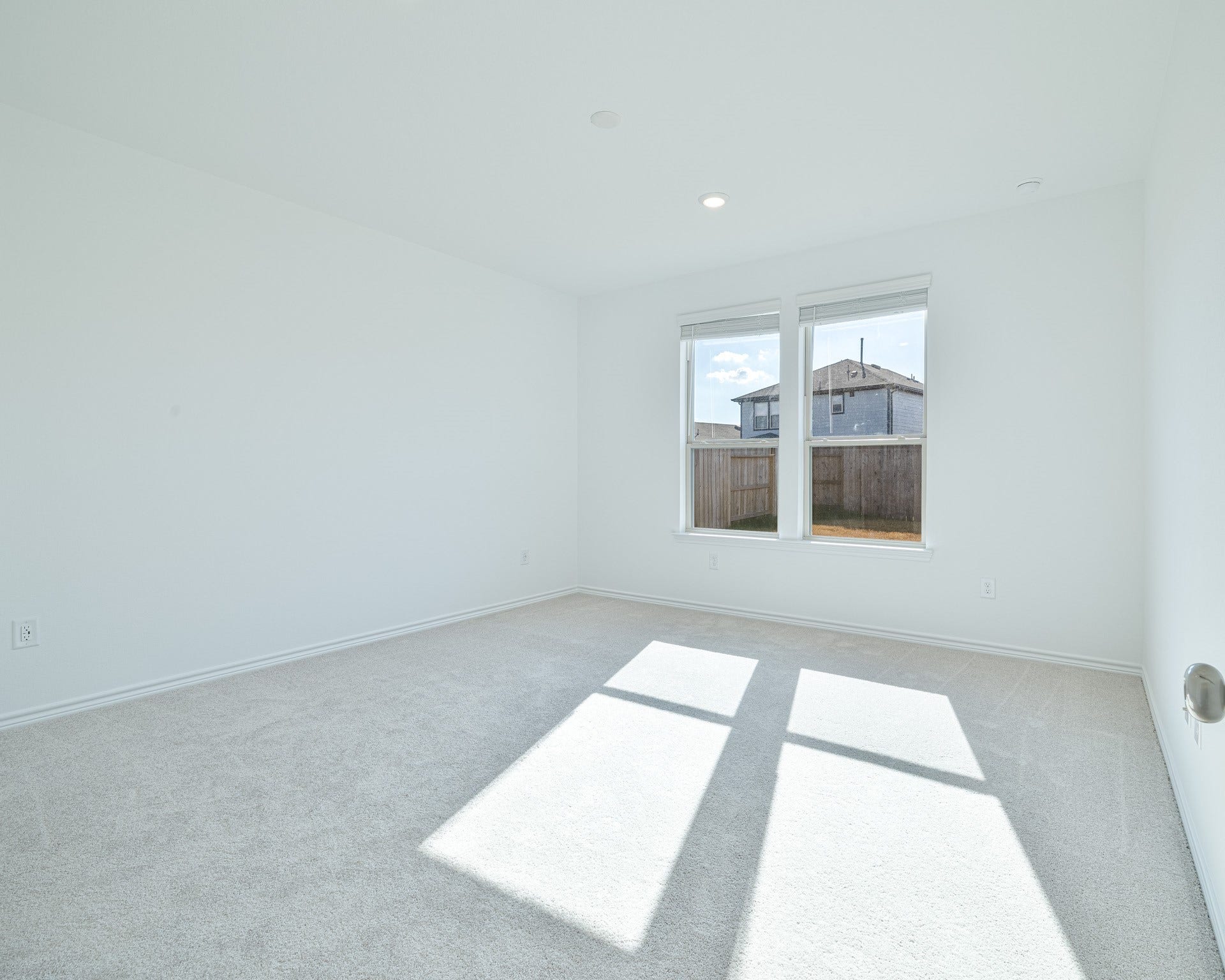 15126 Canyon Rapids Road, Conroe, TX 77302 Spacious primary suite with natural light and peaceful backyard view