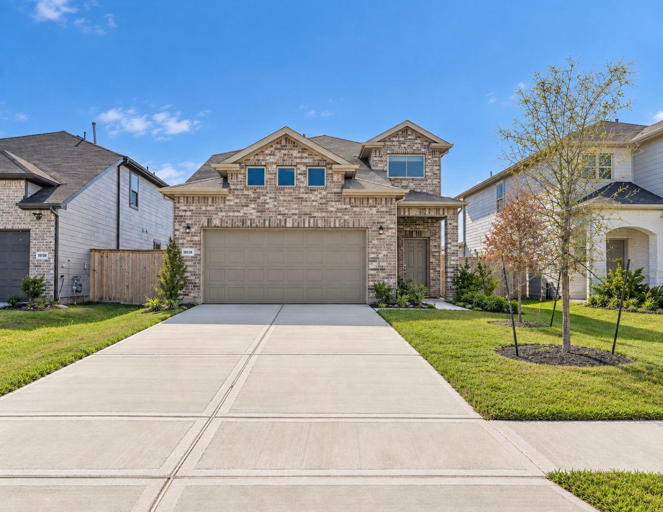 15126 Canyon Rapids Road, Conroe, TX 77302 Beautiful two-story home with brick exterior and two car garage and a welcoming front entrance