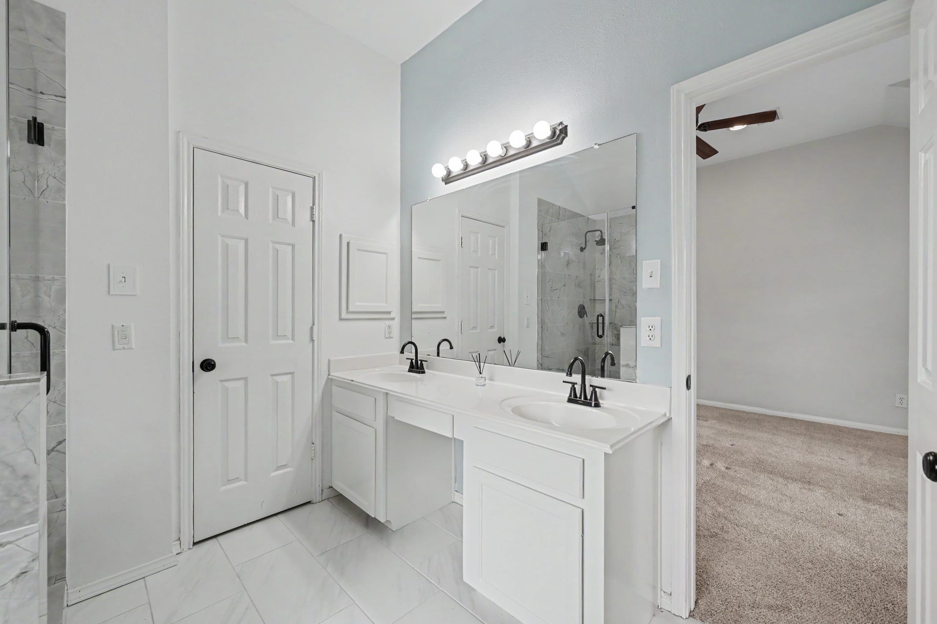 29823 Spring Acres Drive, Spring, TX 77386 Primary bathroom with his & hers sinks & vanity area.