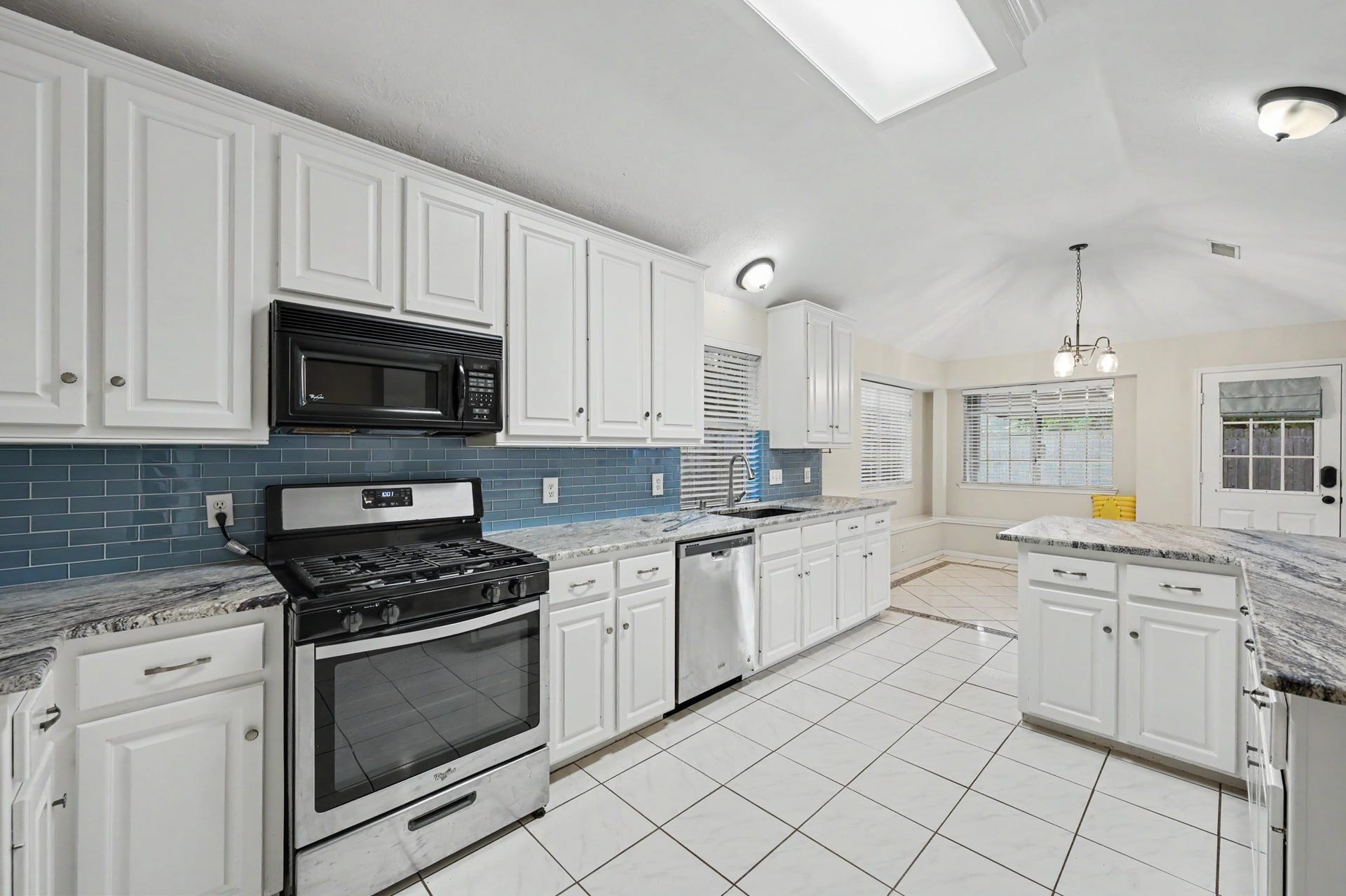 29823 Spring Acres Drive, Spring, TX 77386 Large kitchen w/ upgraded granite counters, stainless appliances and plenty of storage