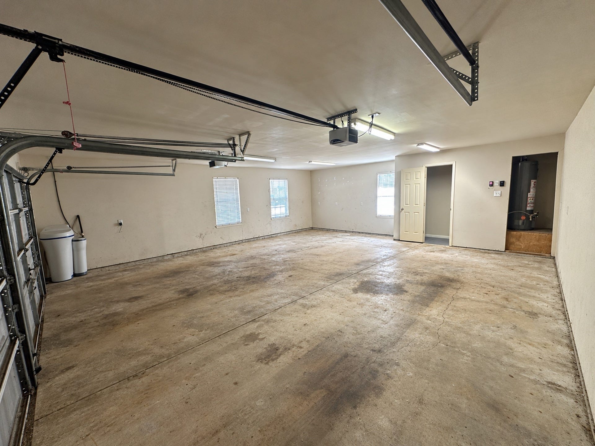 29823 Spring Acres Drive, Spring, TX 77386 Oversized garage w/ added storage, 1/2 bathroom and Water softener.