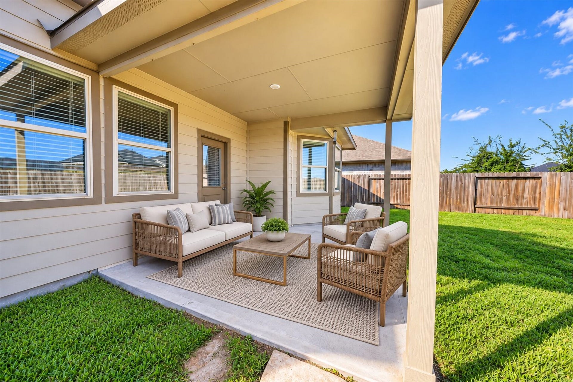 Covered patio and no rear neighbors!
(virtually staged furniture).